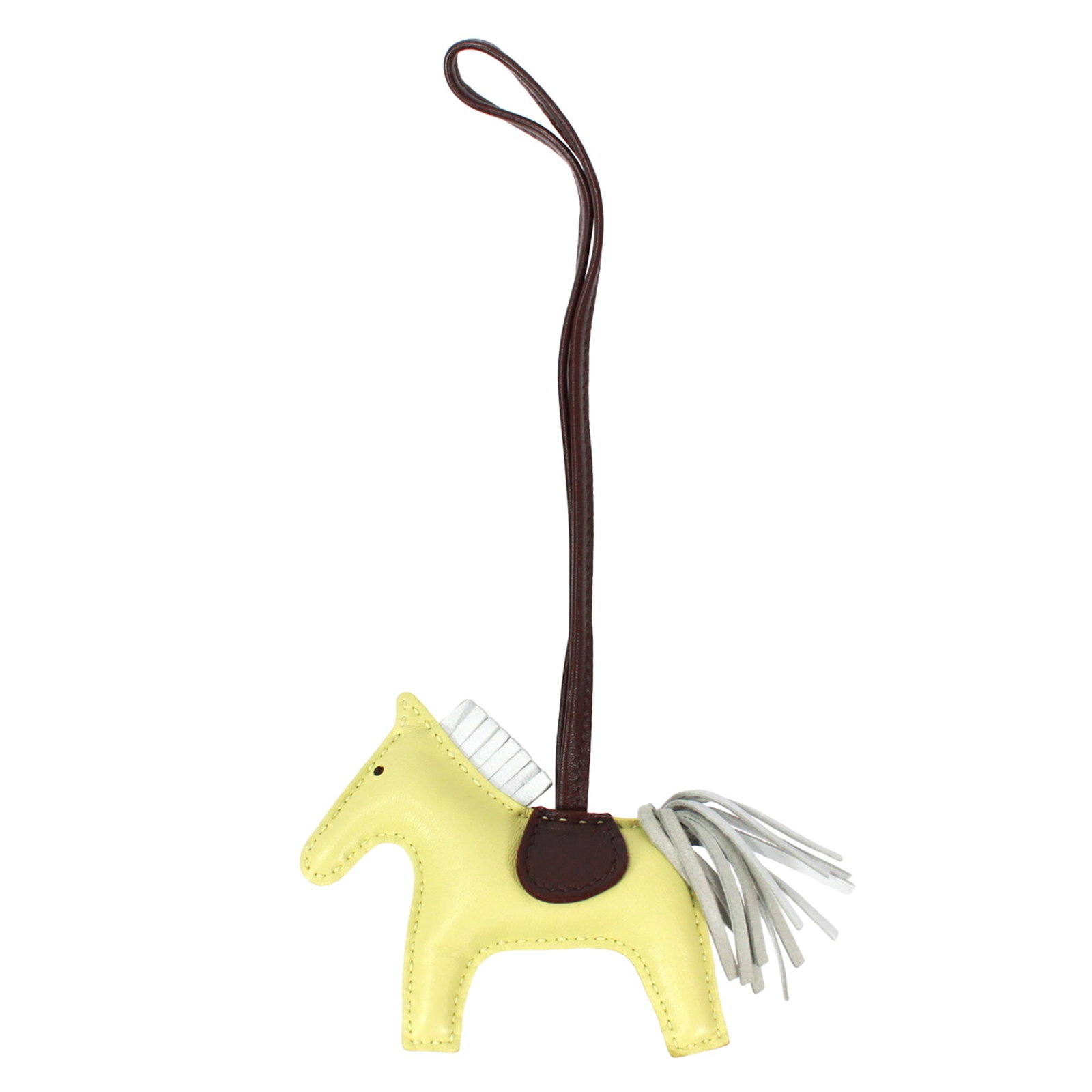 Hermes Handbag Charm Agneau Milo: Hermes Handbag Charm Agneau Milo Agneau Milo, a luxurious material known for its softness and durability, is used to create this distinctive Hermes handbag charm. The charm's brown and yellow hues add