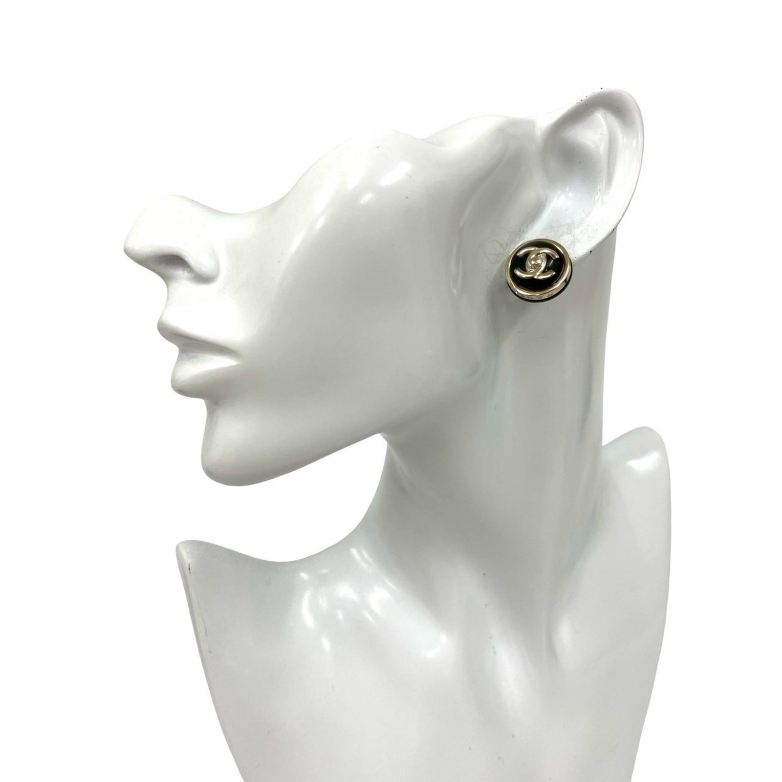 Chanel Stud Earrings Gold Plating: Chanel Stud Earrings Gold Plating Chanel's iconic stud earrings are available in gold plating, featuring a sleek and sophisticated design. The black finish adds a touch of elegance to any outfit, whil