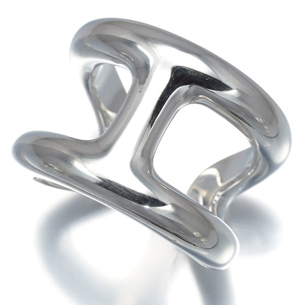 Silver Hermes Sterling Osmose 925 Eu51: Silver Hermes Sterling Osmose 925 Eu51 Sterling silver Osmose ring from Hermes, featuring a sleek design with no main stone. Made from high-quality 925 metal, this ring boasts a sophisticated look