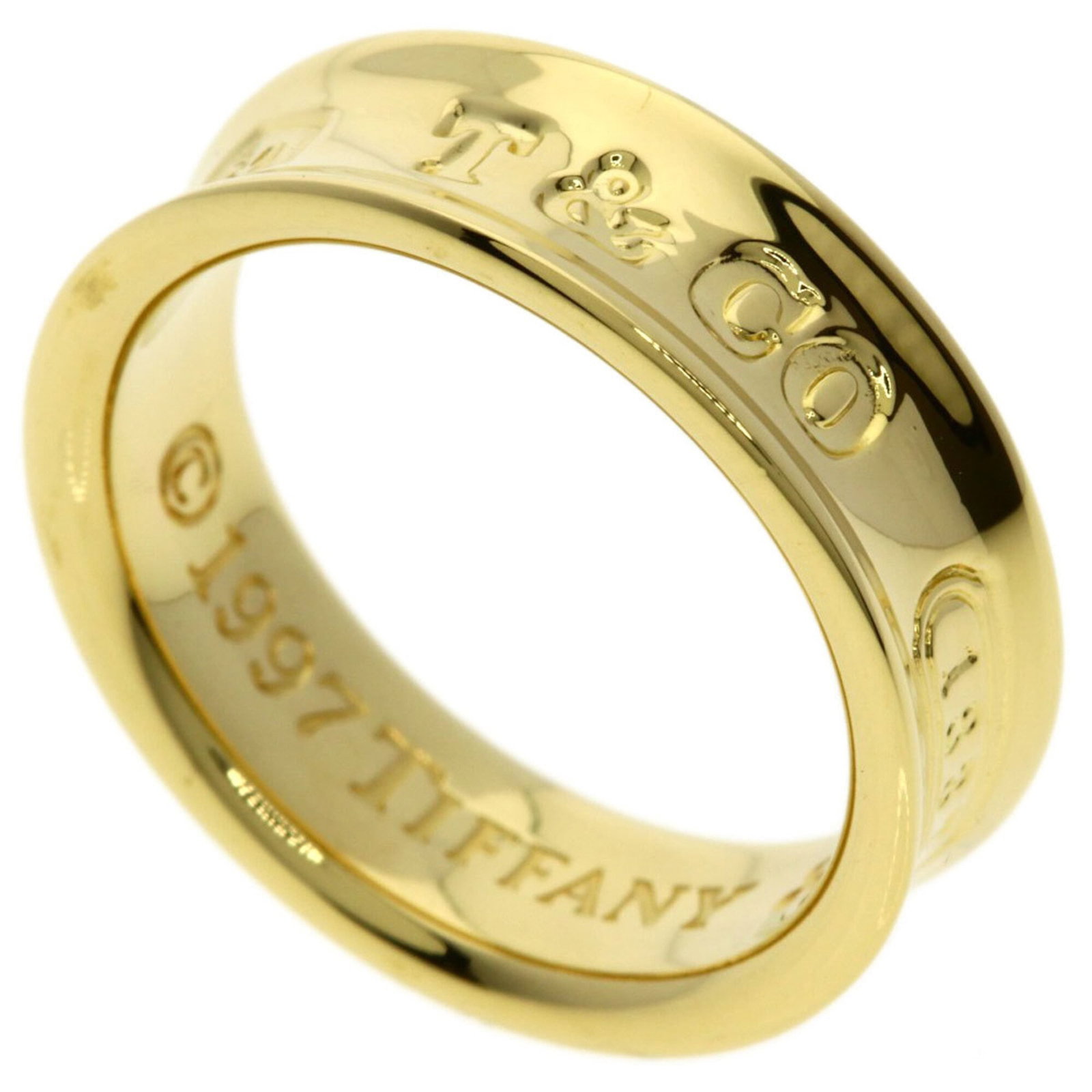 Tiffany Band Ring Yellow Gold (18K): Tiffany Band Ring Yellow Gold (18K) This Tiffany band ring in yellow gold (18K) showcases classic elegance with its simple yet sophisticated design. The 6.5 size fits comfortably on most women's finge