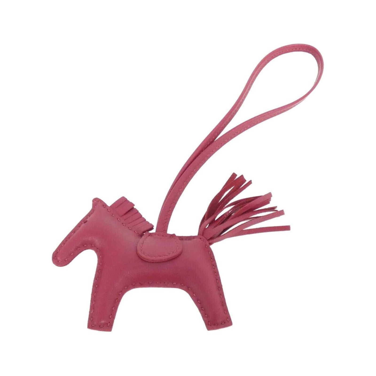 Hermes Handbag Charm Agneau Milo: Hermes Handbag Charm Agneau Milo Ruby Agneau Milo handbag charm from Hermes, featuring a few traces of usage with some scratches and dirt, still in very good condition. This used charm showcases the i