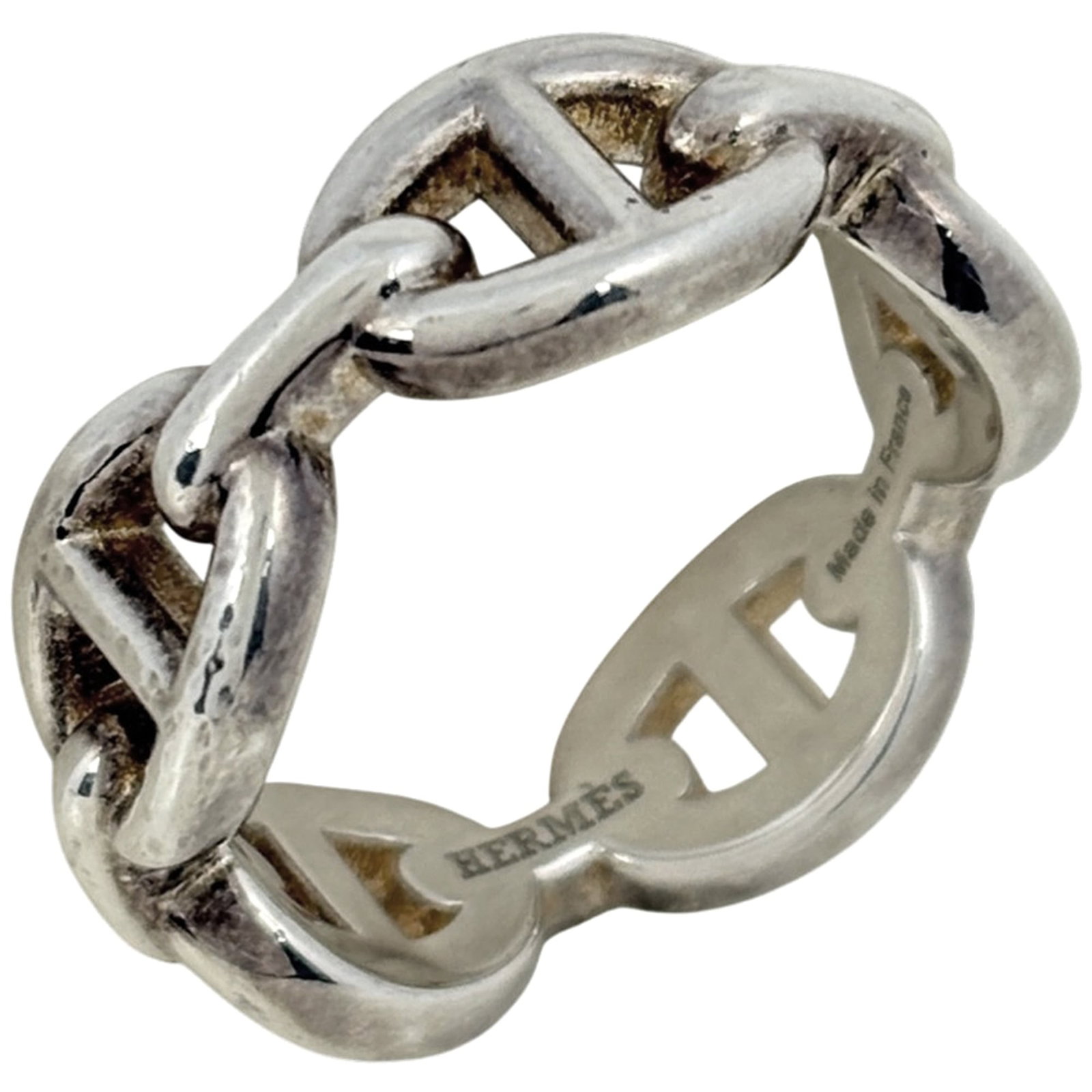 Hermes Band Ring Silver 925: Hermes Band Ring Silver 925 Silver 925 band ring from Hermes features a sleek and modern design. The item has been used and shows signs of wear, with some traces of usage and minor damages visible.