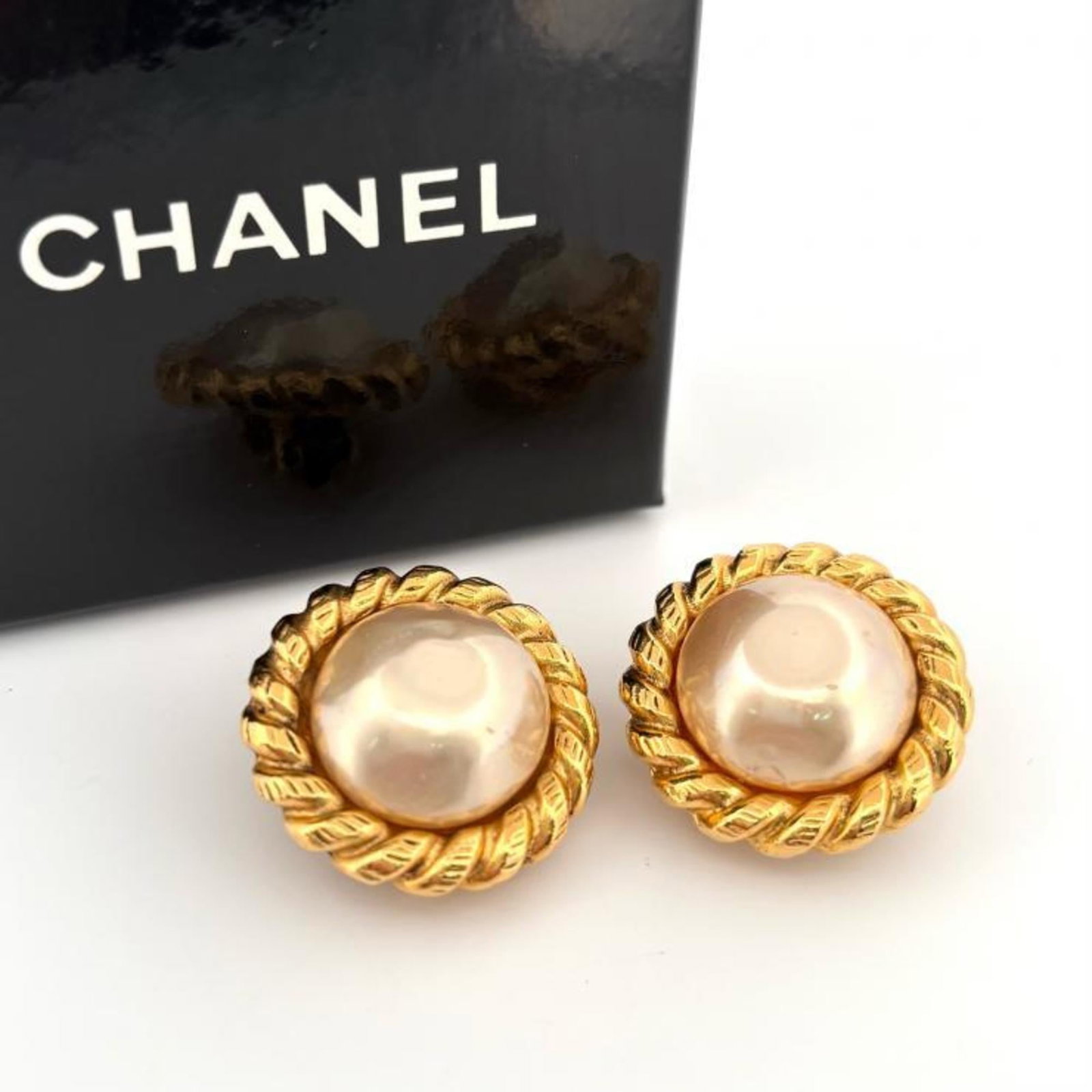 Chanel Clip Earrings Artificial Pearl, Metal: Chanel Clip Earrings Artificial Pearl, Metal Gold and white artificial pearl clip earrings from Chanel, with a classic design that adds a touch of elegance to any outfit. The earrings feature a subtle