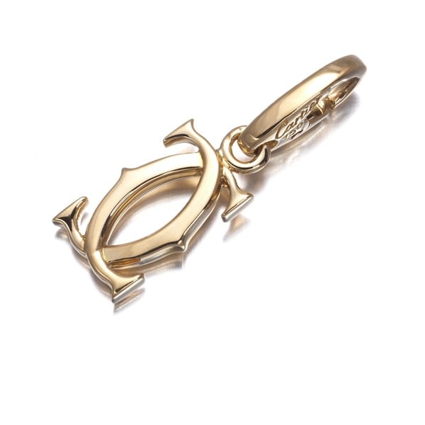 Double C C2 Charm in 18K 750 Yellow Gold: Double C C2 Charm in 18K 750 Yellow Gold The Double C de Cartier charm in 18K yellow gold features a sleek and modern design. This iconic piece from the popular Charm Collection showcases the brand's 