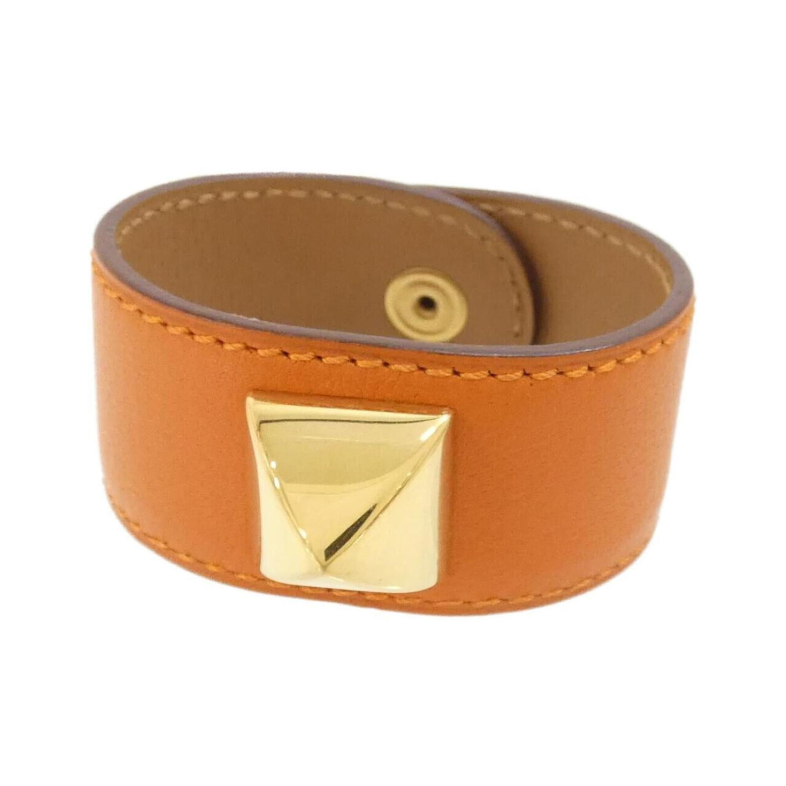 Hermes Charm Bracelet Chevre Leather: Hermes Charm Bracelet Chevre Leather Chevre leather gives this Charm Bracelet its distinctive texture and warmth. The vibrant orange color adds a pop of personality to any outfit. With some minor