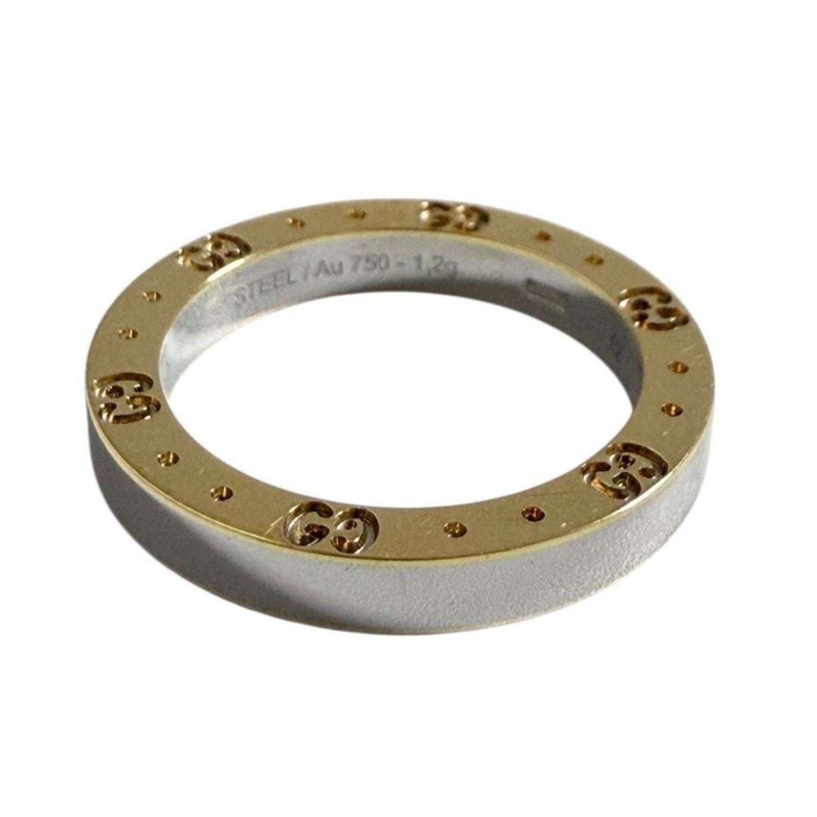 Gucci Band Ring Stainless Steel, Yellow Gold (18K): Gucci Band Ring Stainless Steel, Yellow Gold (18K) Stainless Steel and Yellow Gold (18K) come together in this Gucci Band Ring, offering a sleek and sophisticated design. The ring's used condition
