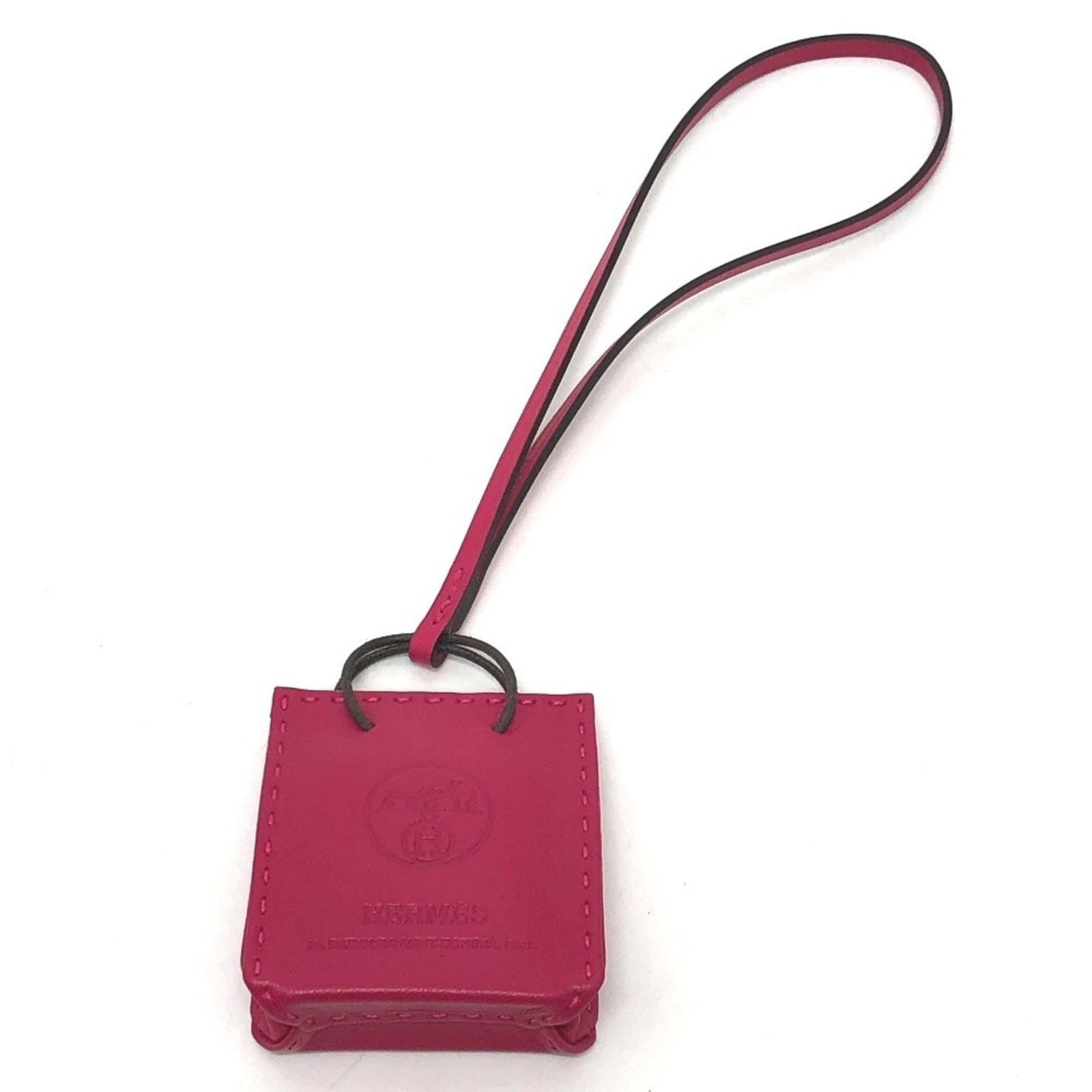 Hermes Handbag Charm Agneau Milo: Hermes Handbag Charm Agneau Milo Agneau Milo is a luxurious material used in this Hermes Handbag Charm. The purple color adds a touch of elegance to this like-new, mint condition charm. Its
