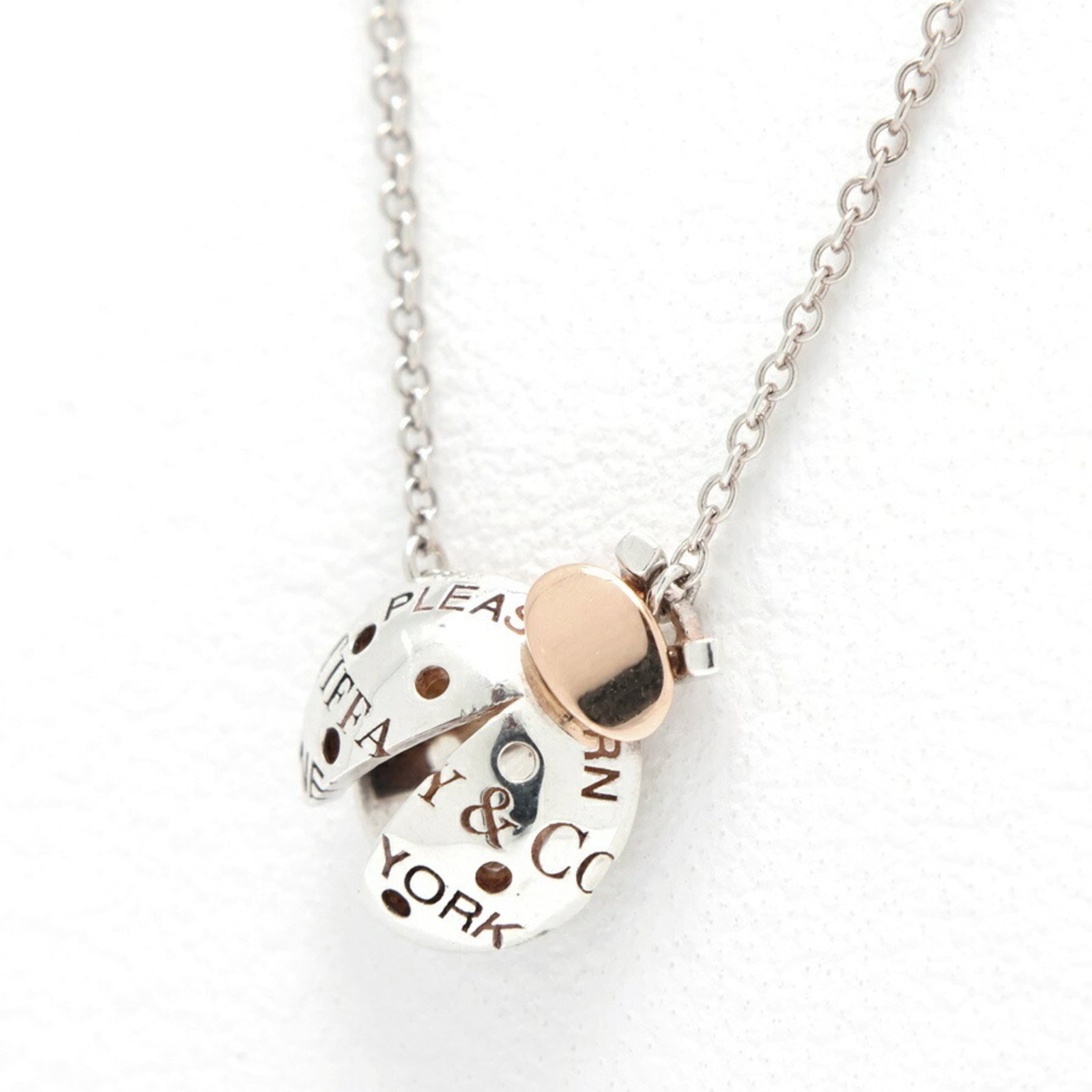 Tiffany & Co. Return to Ladybug Collection Necklace, Sterling Silver (925) and 18K Pink Gold, 46 cm: Tiffany & Co. Return to Ladybug Collection Necklace, Sterling Silver (925) and 18K Pink Gold, 46 cm Sterling silver and 18K pink gold come together in this elegant Return to Ladybug Collection