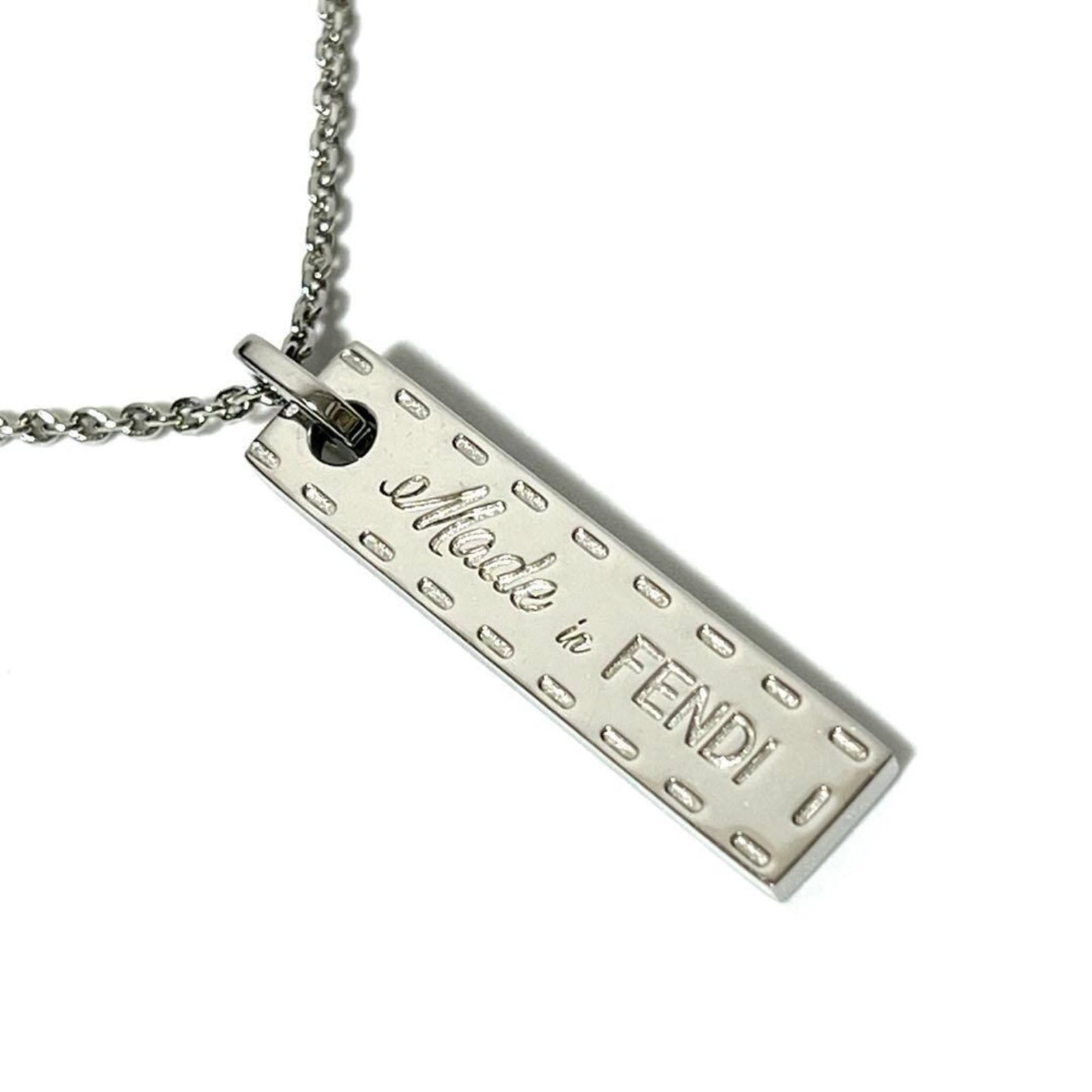 Fendi Men's Necklace Pendant Made in FENDI: Fendi Men's Necklace Pendant Made in FENDI Authentic Fendi men's necklace pendant made from metal, available in sizes to fit neck circumferences of 50 cm - 56 cm. This used item has some scratches