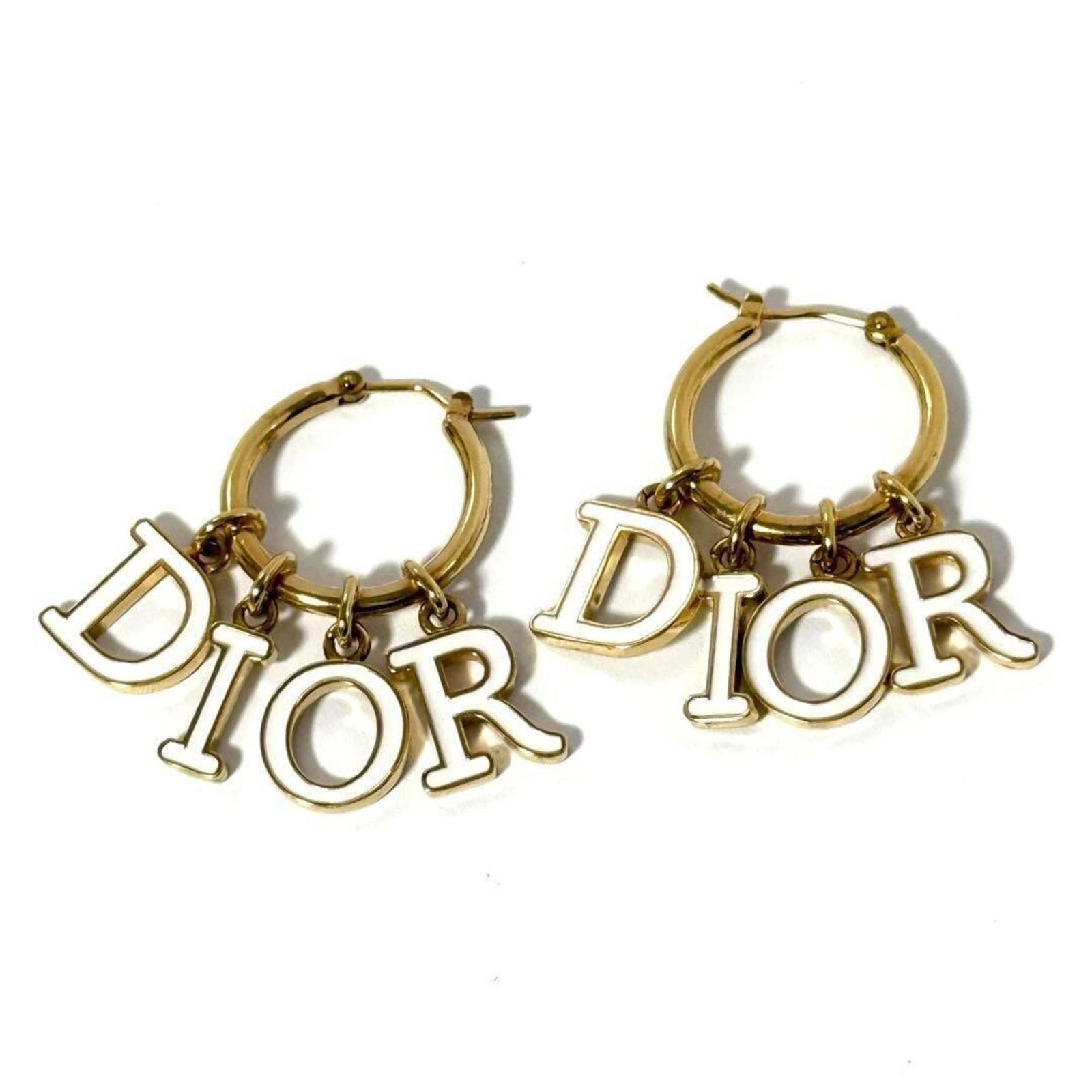 Christian Dior Hoop Earrings Metal: Christian Dior Hoop Earrings Metal Christian Dior's iconic hoop earrings are a timeless design element. Made from metal and bearing a few traces of usage, these earrings showcase subtle signs of