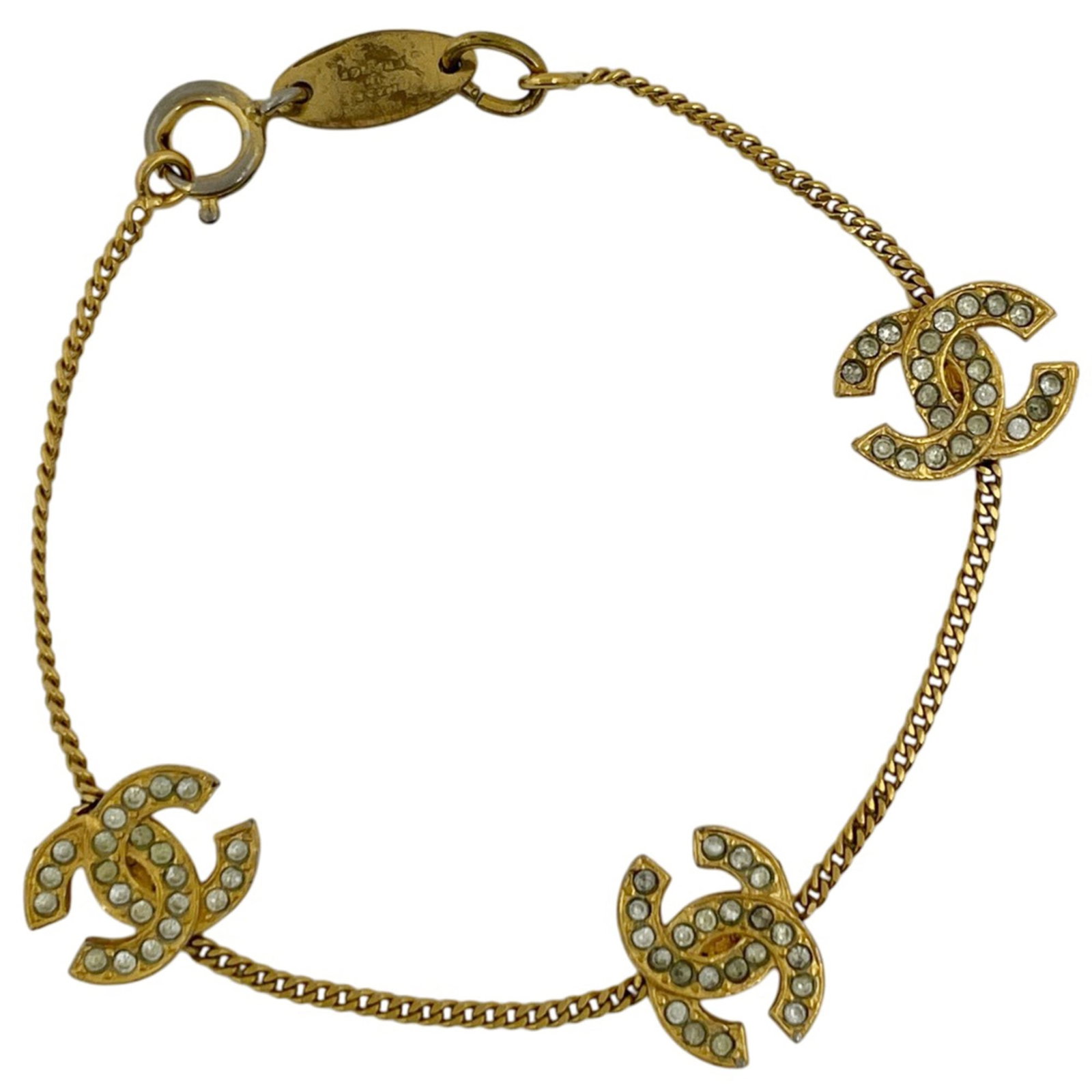 Chanel Charm Bracelet Rhinestone: Chanel Charm Bracelet Rhinestone Chanel's iconic charm bracelet features a stunning rhinestone design in gold. The 17.5cm length showcases a delicate charm with a touch of luxury. With its used
