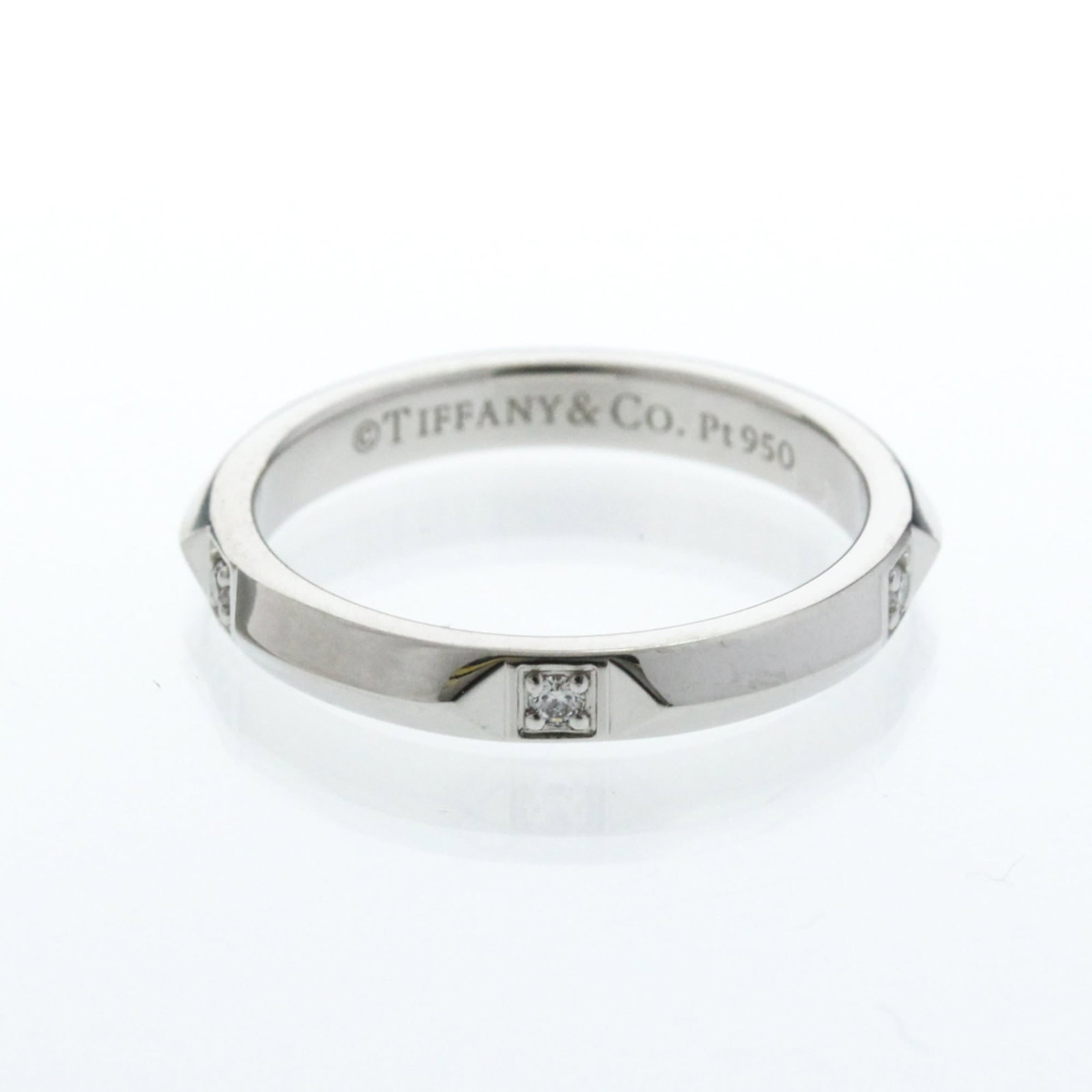 Tiffany Band Ring Platinum: Tiffany Band Ring Platinum Platinum band ring with a diamond stone, crafted from high-quality platinum metal. This Tiffany brand ring features a sleek design and a silver color, making it a stylish ad