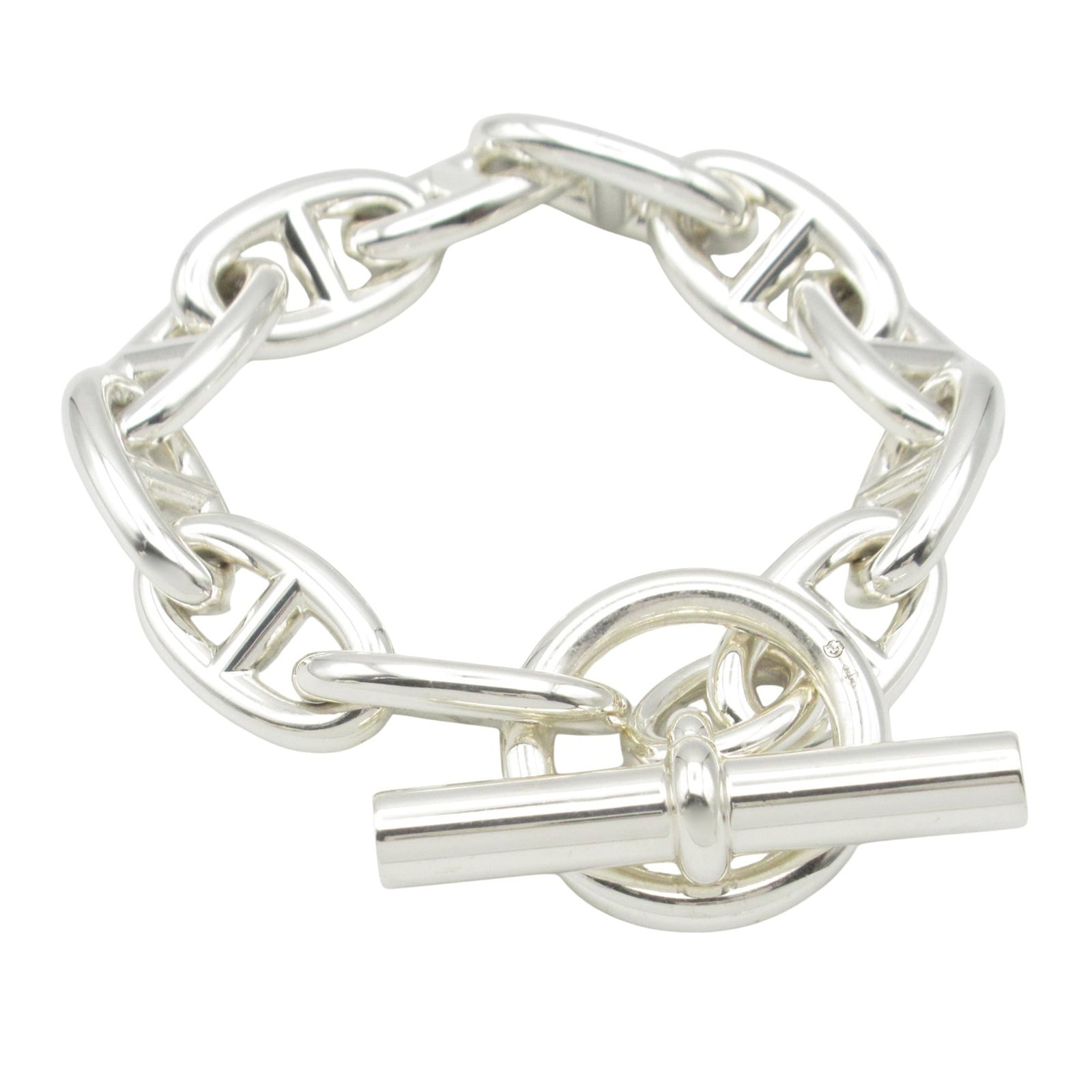 Hermes Charm Bracelet: Hermes Charm Bracelet Silver charm bracelet from Hermes with a length of 15cm and a weight of 63.7g, featuring a metal purity of Silver925. This opened, never used piece boasts a sleek design, making