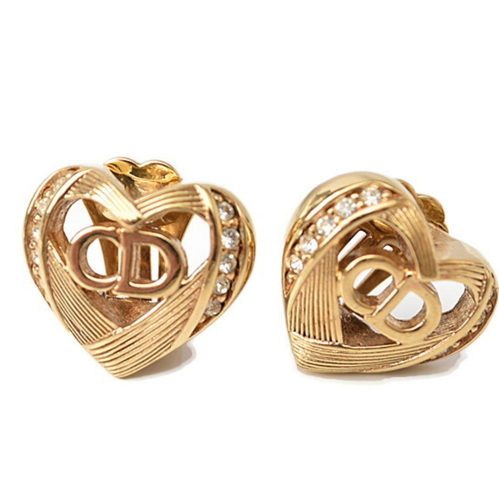 Christian Dior Clip Earrings: Christian Dior Clip Earrings Christian Dior Clip Earrings in Gold feature a sleek and sophisticated design. Made from high-quality materials, these earrings showcase a subtle shine with a few traces o