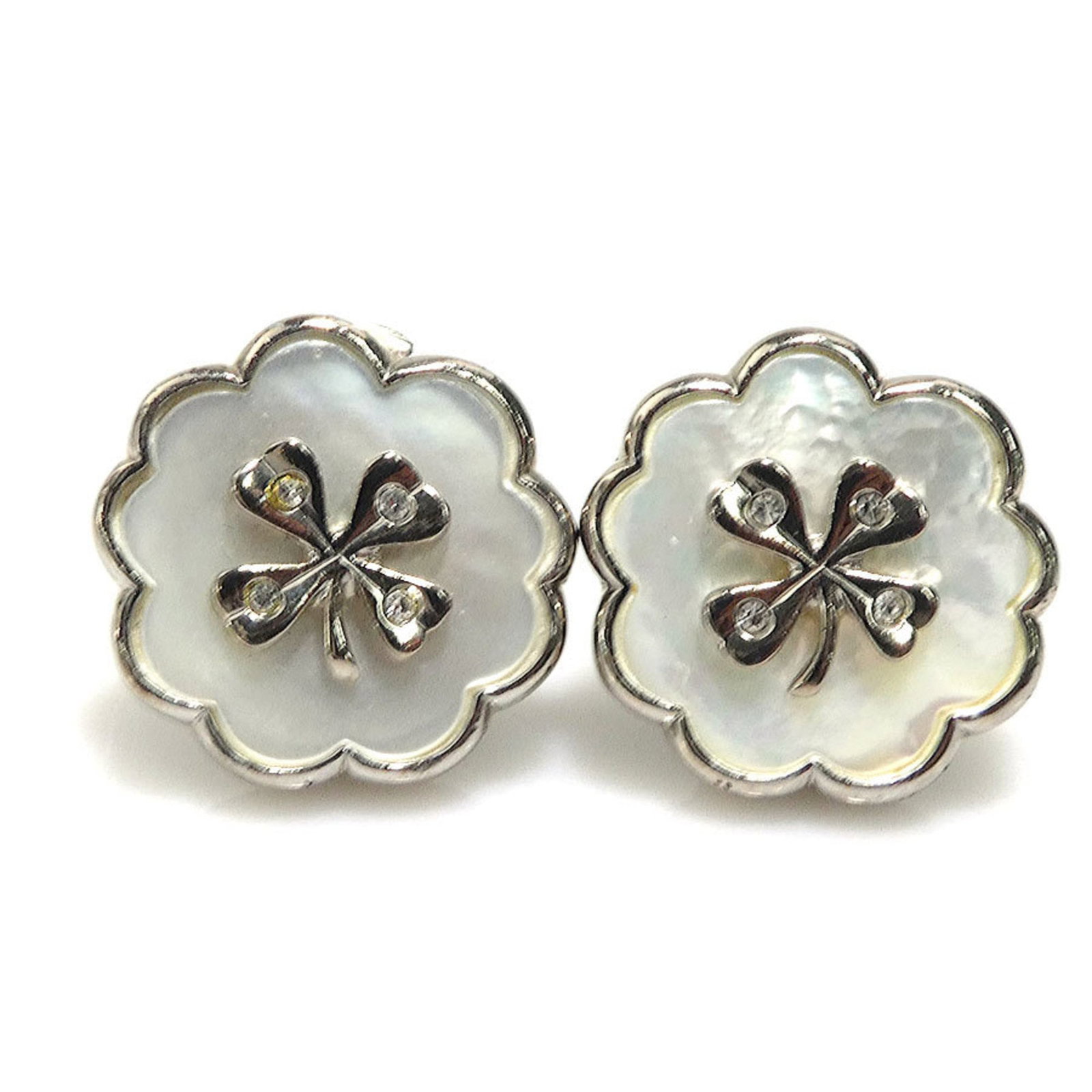 Chanel Clip Earrings Metal, Shell: Chanel Clip Earrings Metal, Shell Silver and white shell Chanel clip earrings in good used condition. The metal has some scratches and traces of usage, giving them a worn-in look. A classic accessory