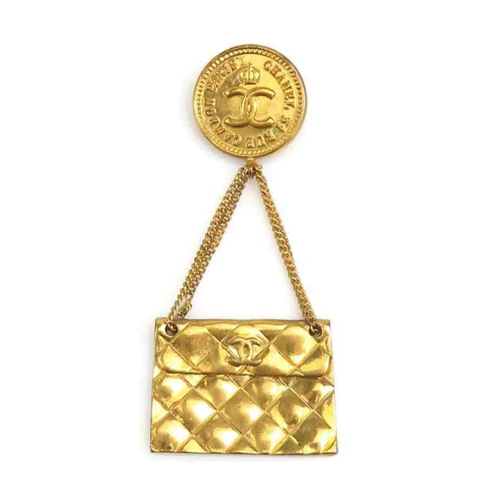 Chanel Brooch Metal: Chanel Brooch Metal Gold Chanel Brooch with Traces of Usage. This 7.8cm x 3.3cm metal brooch features a gold finish and bears signs of previous use, including scratches and dirt. Its condition
