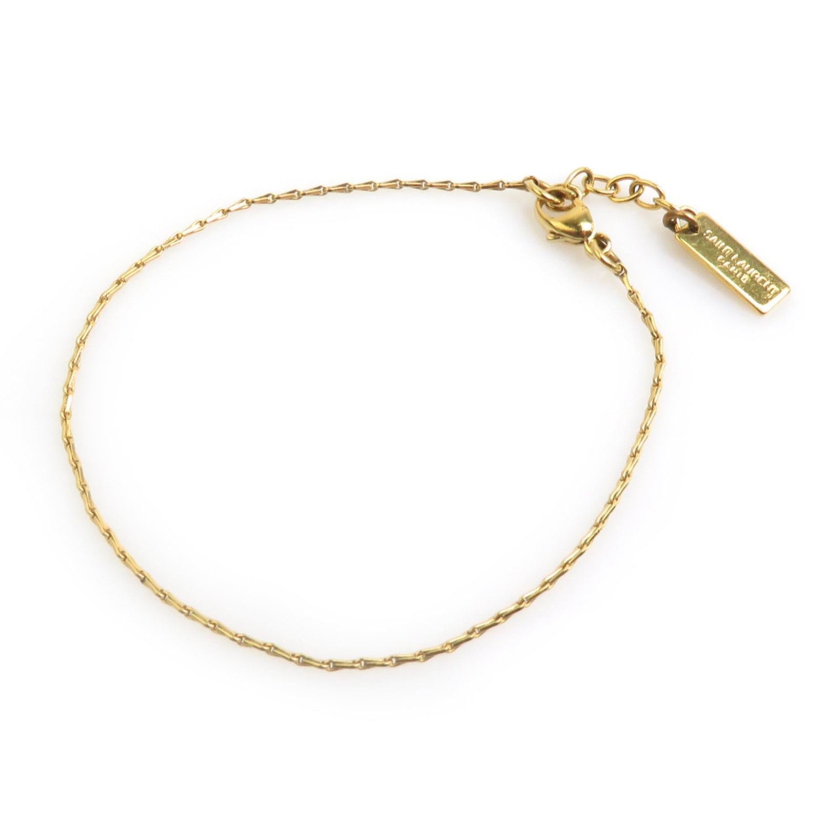 Saint Laurent Charm Bracelet Metal: Saint Laurent Charm Bracelet Metal Saint Laurent Charm Bracelet Metal features a gold metal design with traces of usage and minor scratches. The length is 15.5cm / 6.1'' in a classic charm bracelet