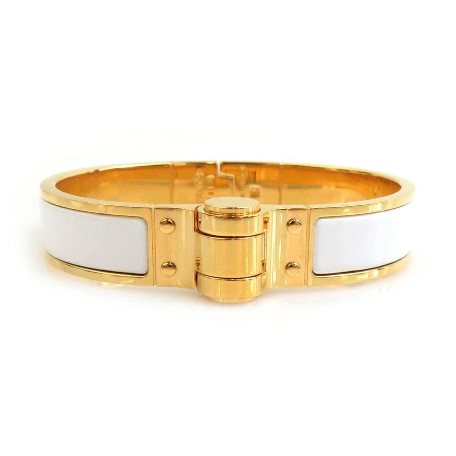 Hermes Bangle Enamel, Metal: Hermes Bangle Enamel, Metal This Hermes bangle boasts an elegant gold and white enamel design, showcasing the luxury of this iconic brand. The metal construction adds durability to its sleek,