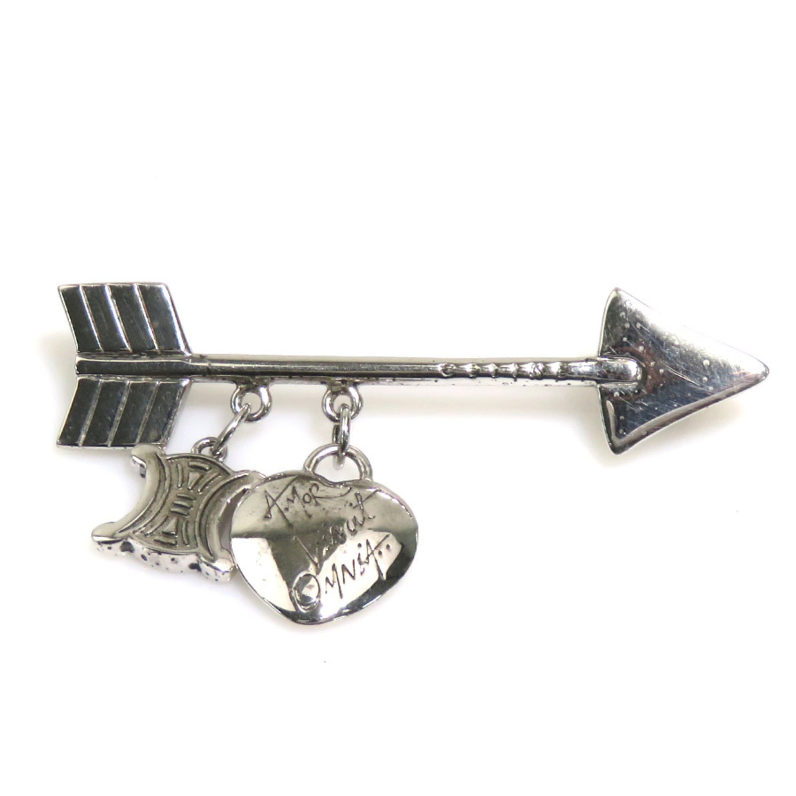 Celine Brooch Silver 925: Celine Brooch Silver 925 The Celine Brooch Silver 925 boasts elegant design and premium silver construction. With its subtle scratches and signs of usage, this brooch showcases a well-worn patina that