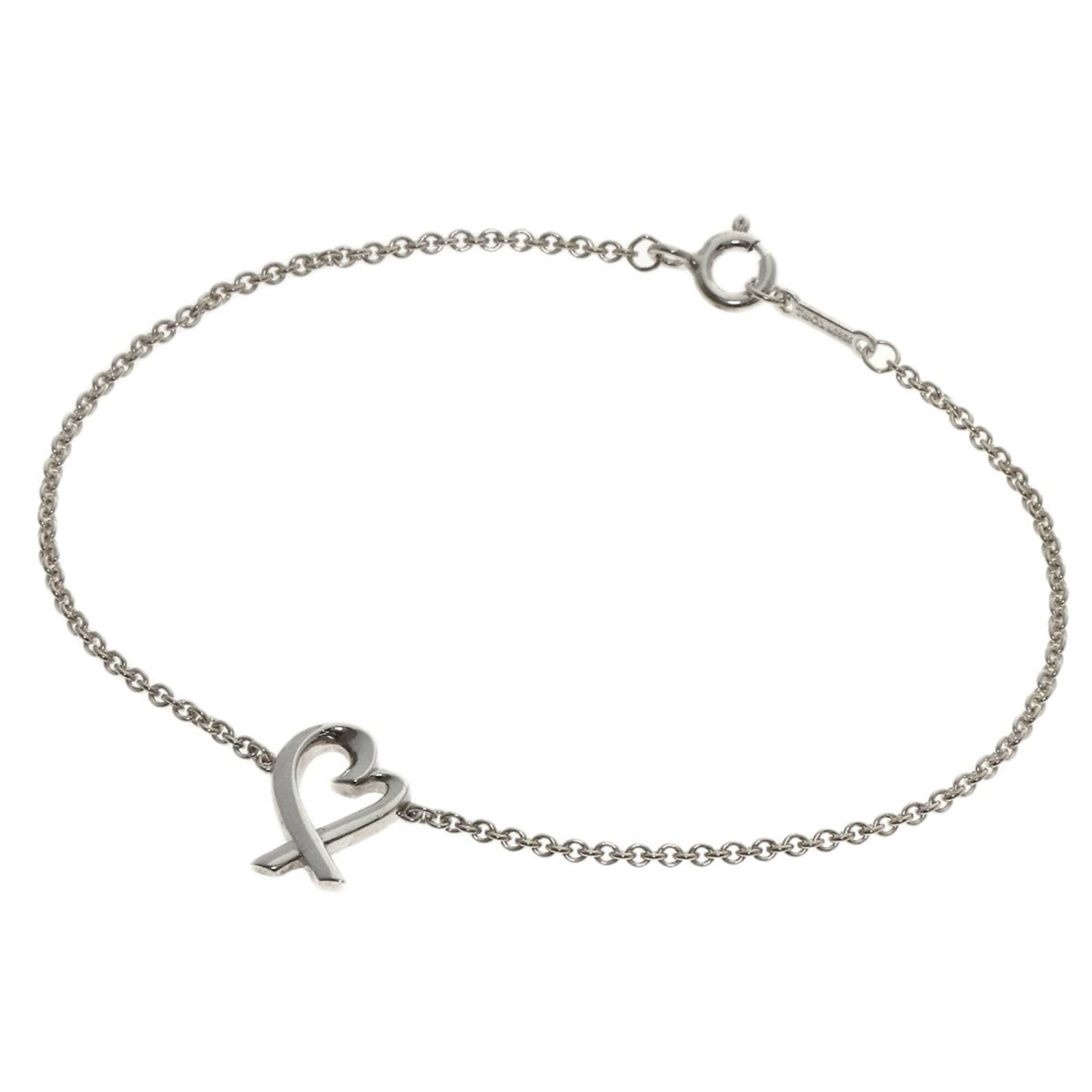 Tiffany Charm Bracelet Silver: Tiffany Charm Bracelet Silver The Tiffany Charm Bracelet Silver boasts an elegant design with subtle scratches and minor dirt marks, giving it a worn-in look. Made from high-quality silver, this charm