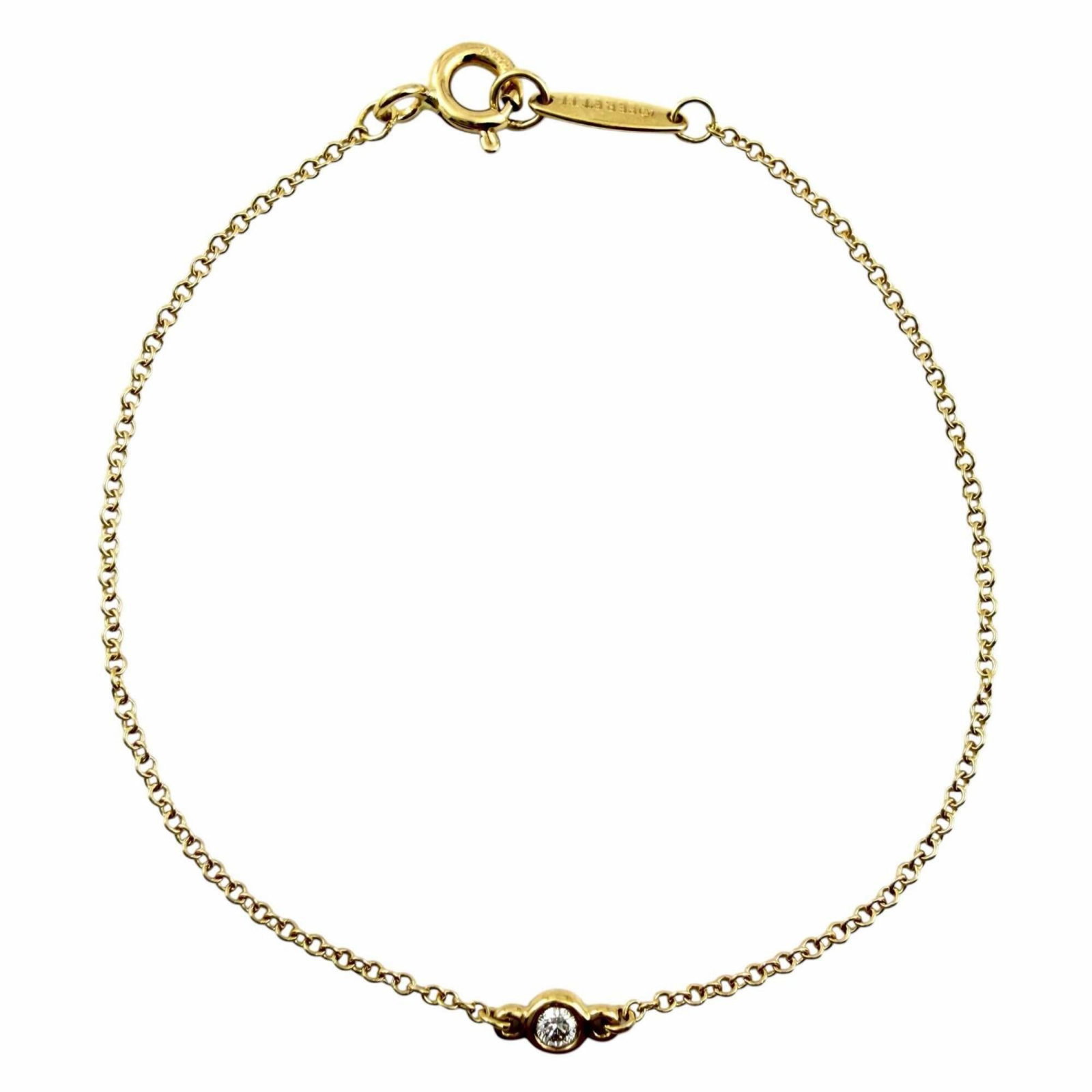 Tiffany Charm Bracelet Yellow Gold (18K): Tiffany Charm Bracelet Yellow Gold (18K) Yellow Gold (18K) Tiffany Charm Bracelet in Excellent Condition. This beautiful charm bracelet features a rich yellow gold finish and measures 15cm in length. 