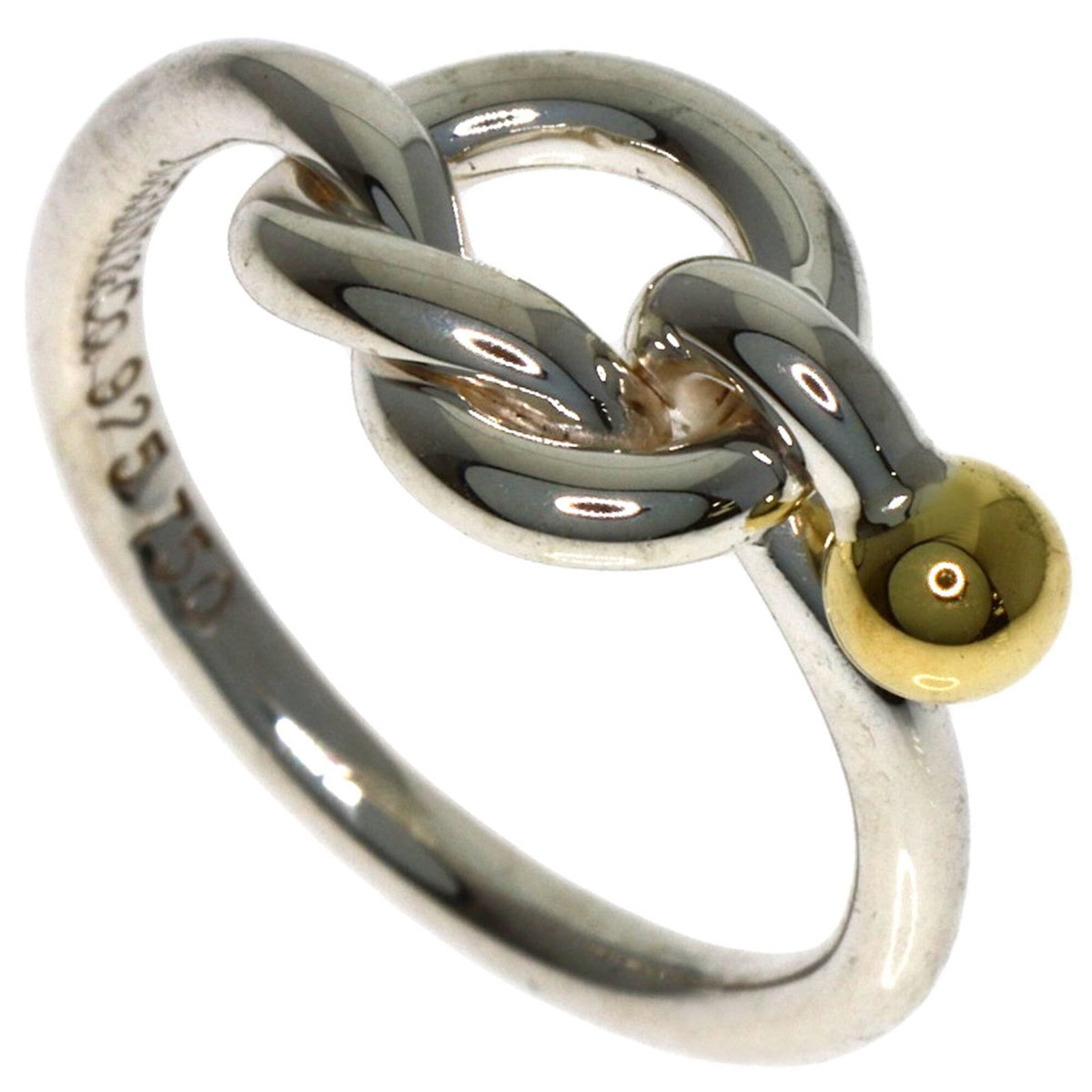 Tiffany Band Ring Silver, Yellow Gold (18K): Tiffany Band Ring Silver, Yellow Gold (18K) Silver band ring from Tiffany featuring yellow gold accents in 18K quality. This like-new condition ring boasts a subtle shine and elegant design, making