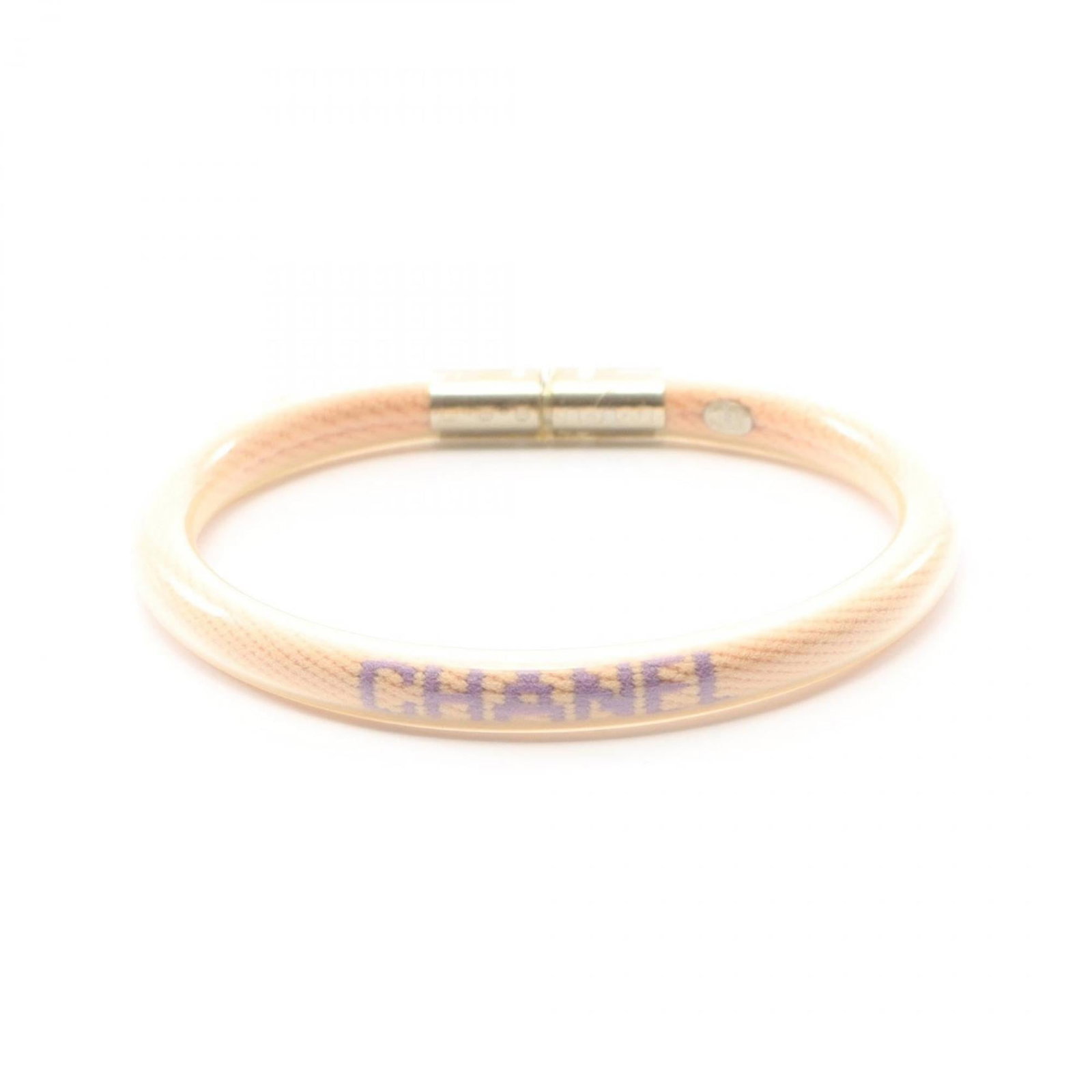 Chanel Charm Bracelet Rubber: Chanel Charm Bracelet Rubber This Chanel Charm Bracelet Rubber features a soft pink hue and has been worn to show its gentle wear. A few minor scratches and dirt marks can be seen on the surface, but