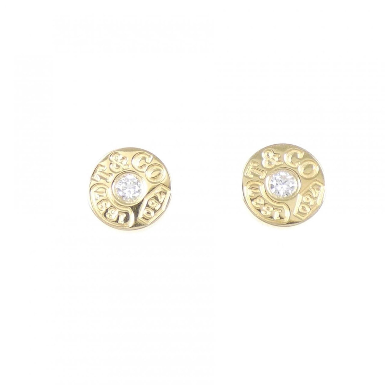 Tiffany Stud Earrings Yellow Gold (18K): Tiffany Stud Earrings Yellow Gold (18K) Yellow gold (18K) stud earrings from Tiffany feature a diamond stone. The earrings have some scratches and dirt, with only minor traces of usage, still in very 