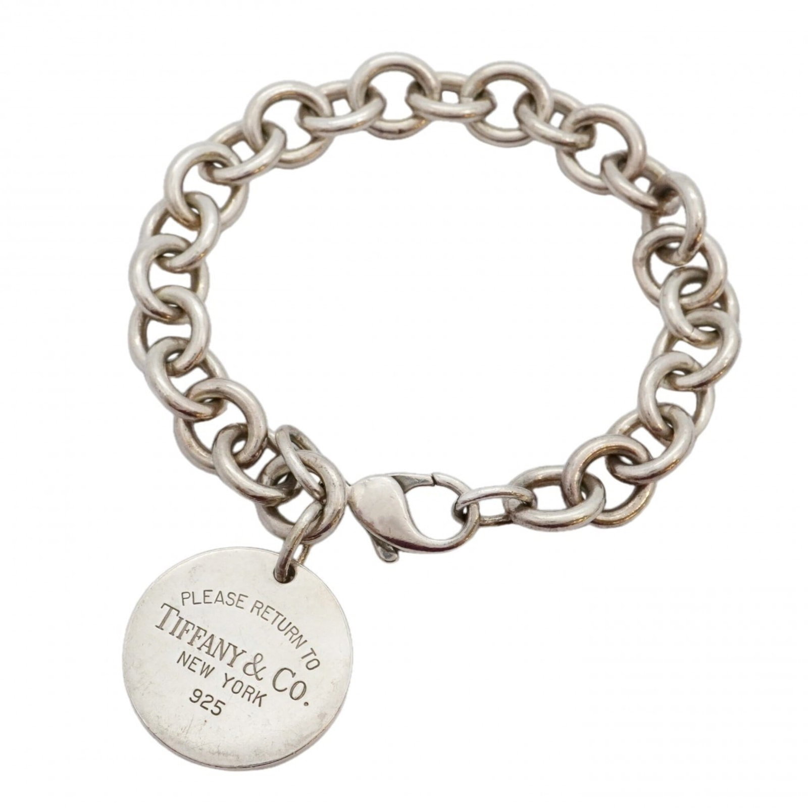Tiffany Charm Bracelet Silver 925: Tiffany Charm Bracelet Silver 925 Silver 925 Tiffany Charm Bracelet with Traces of Usage. This used charm bracelet features silver 925 material and has a length of 17.5cm. The bracelet shows signs of