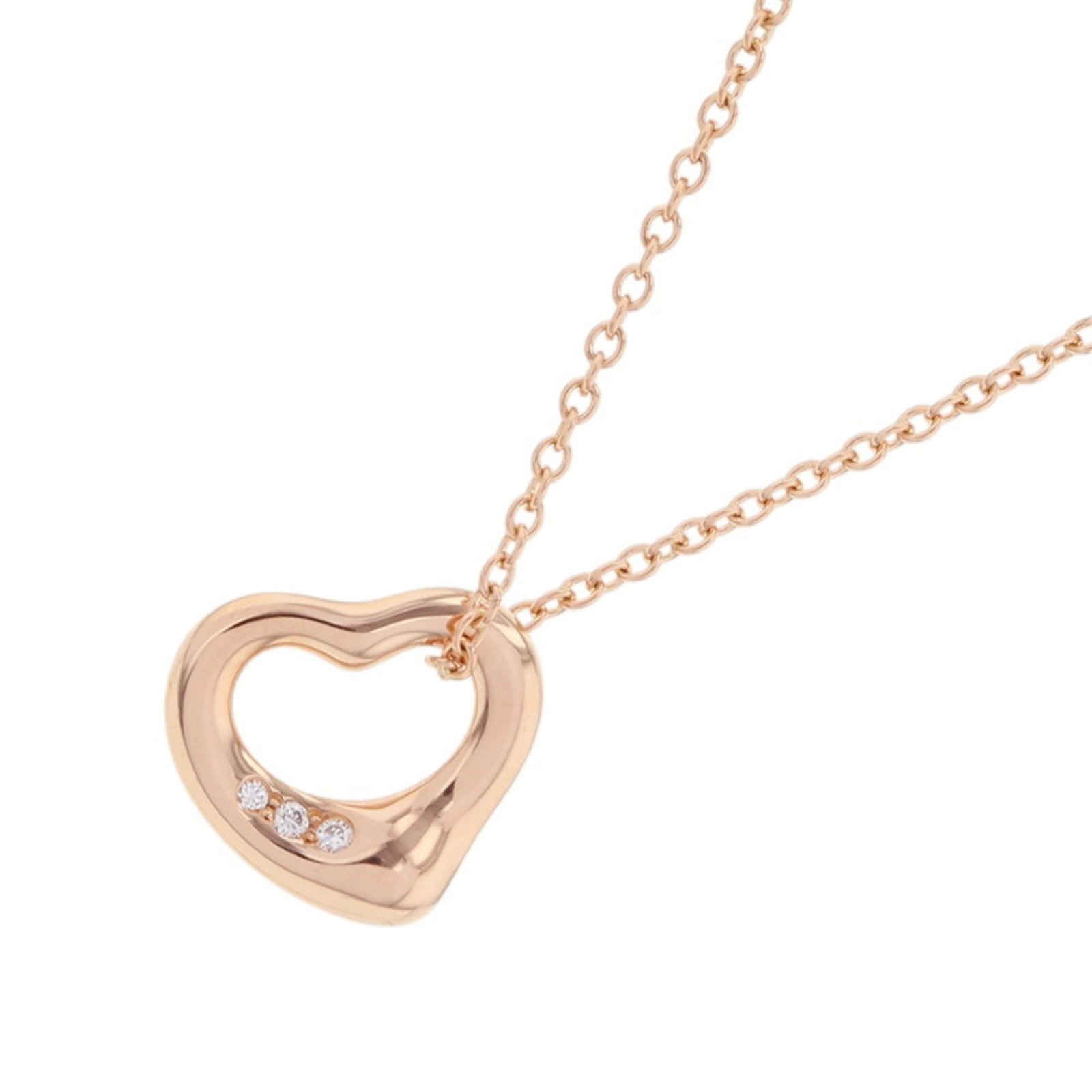 Tiffany & Co. Elsa Peretti Heart Pendant Necklace with 0.01ct Diamonds, 18K Pink Gold, Item Number: Tiffany & Co. Elsa Peretti Heart Pendant Necklace with 0.01ct Diamonds, 18K Pink Gold, Item Number 68113660. The Tiffany & Co. Elsa Peretti Heart Pendant Necklace boasts understated elegance with its 