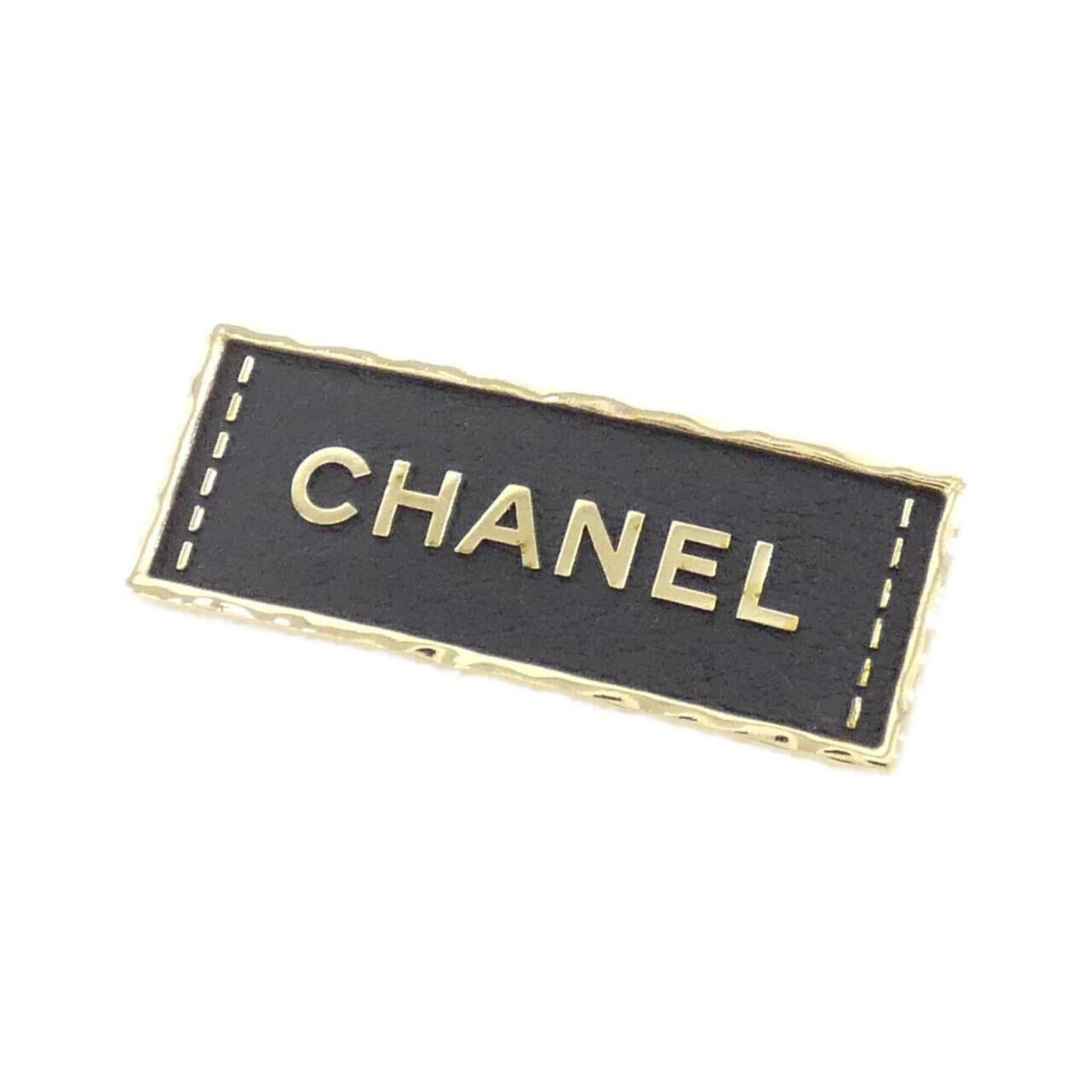 Chanel Brooch: Chanel Brooch This Chanel brooch boasts sleek black design with subtle scratches and minor dirt marks, giving it a worn-in look. Measuring 2cm x 5.5cm, its compact size makes it a versatile accessory