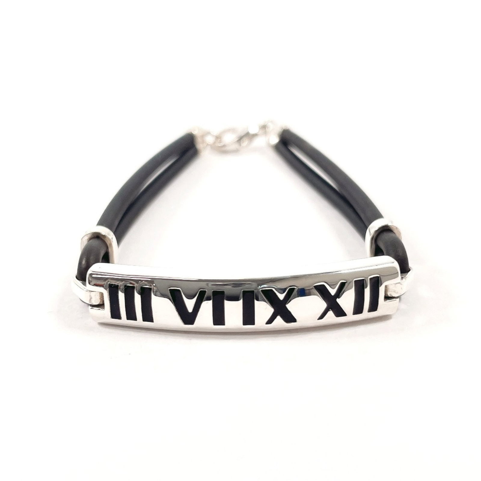 Tiffany Charm Bracelet Rubber, Silver 925: Tiffany Charm Bracelet Rubber, Silver 925 Silver 925 charm bracelet with rubber accents in black and silver tones features a unique design. The bracelet has some scratches and dirt from previous use,