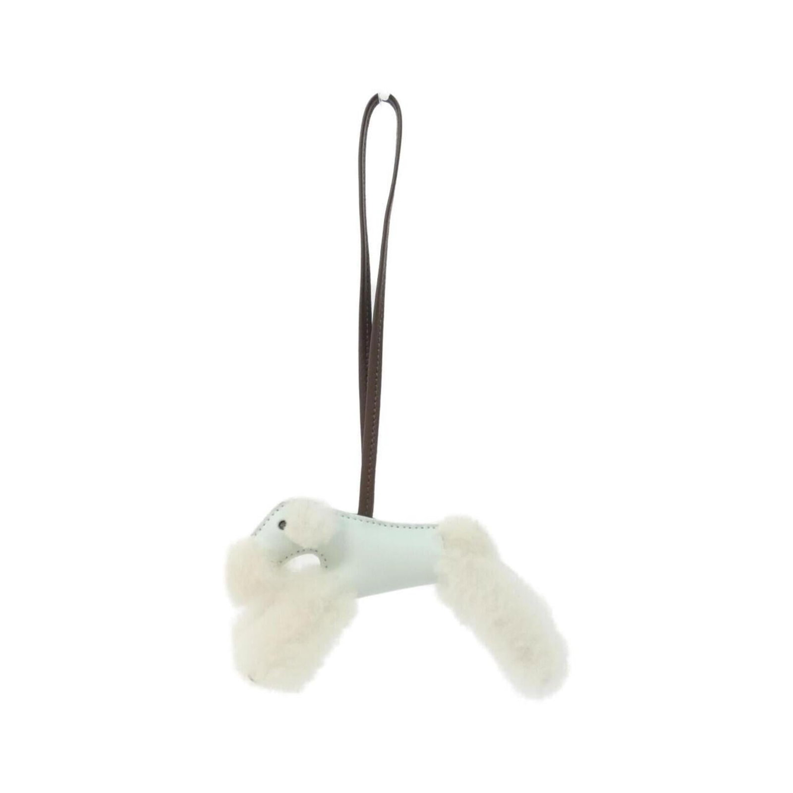 Hermes Handbag Charm Agneau Milo: Hermes Handbag Charm Agneau Milo Agneau Milo Handbag Charm from Hermes boasts a rich, chocolate brown hue and earthy tones in ecru and green. The intricate design of this charm showcases the exception