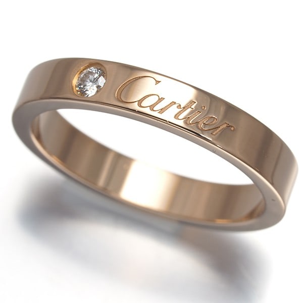 Diamond Ring for 1 Person: Diamond Ring for 1 Person Cartier's C de Cartier collection shines in this elegant 18k rose gold diamond ring. The natural diamond main stone is set against a backdrop of refined metalwork, showcasing