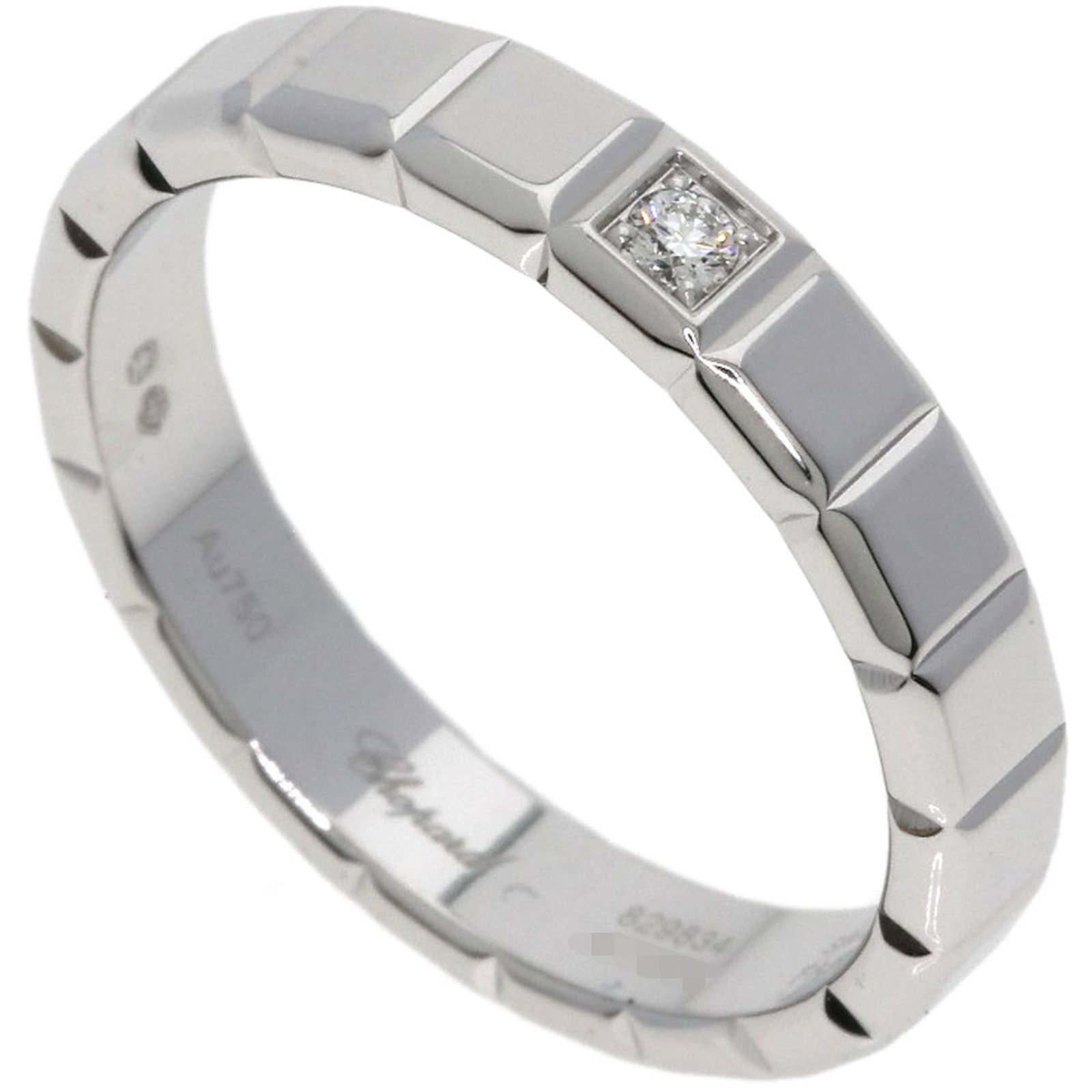 Chopard Band Ring White Gold (18K): Chopard Band Ring White Gold (18K) Chopard's iconic band ring shines in this stunning 18K white gold design. Featuring a high-quality diamond stone and a sleek, slender profile, this elegant piece exu