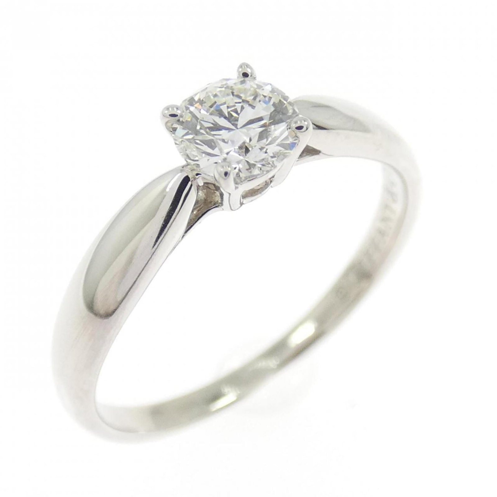 Tiffany Band Ring Platinum 950: Tiffany Band Ring Platinum 950 Platinum band ring from Tiffany featuring a diamond stone weighing 0.31 carats in size and set in platinum 950 material. The ring has a US size of 4 and weighs 2.4g /