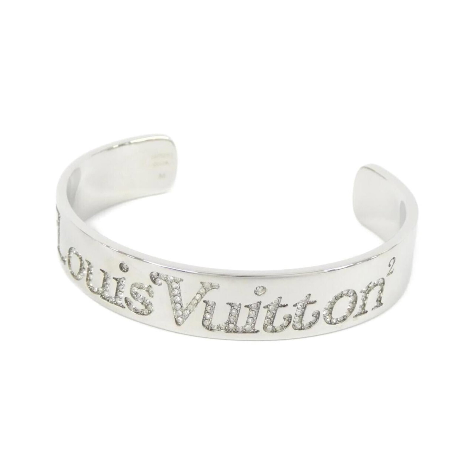 Louis Vuitton Bangle: Louis Vuitton Bangle Silver Louis Vuitton Bangle with a length of 16.5cm, bearing a few traces of usage and minor scratches/dirt, available in used condition. The bangle's silver finish shows signs