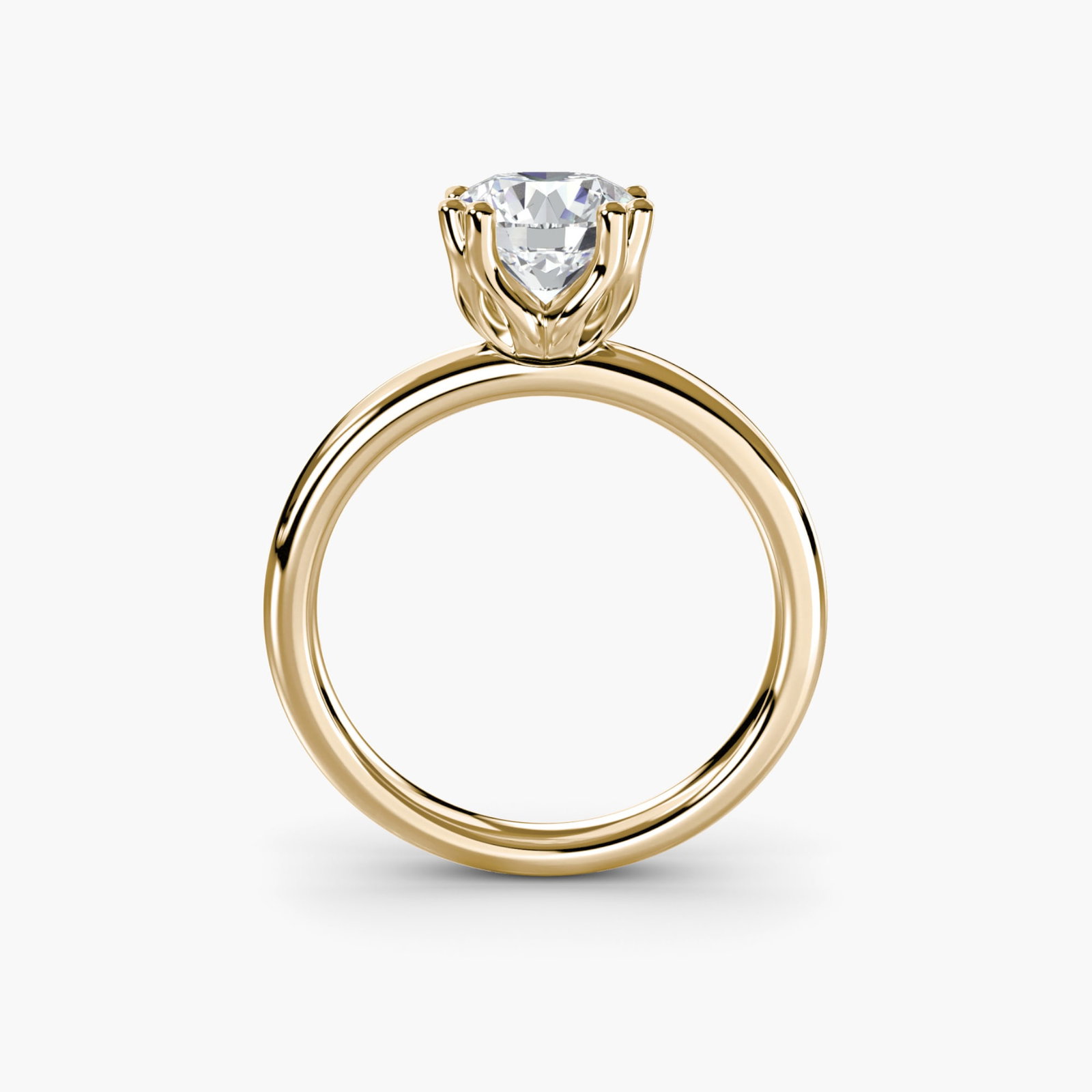 Solitaire Round 18Kt Yellow Gold Ring Setting: Solitaire Round 18Kt Yellow Gold Ring Setting The Solitaire Round 18Kt Yellow Gold Ring Setting boasts a sleek and timeless design, featuring a round setting with a subtle 2mm band width. Crafted from