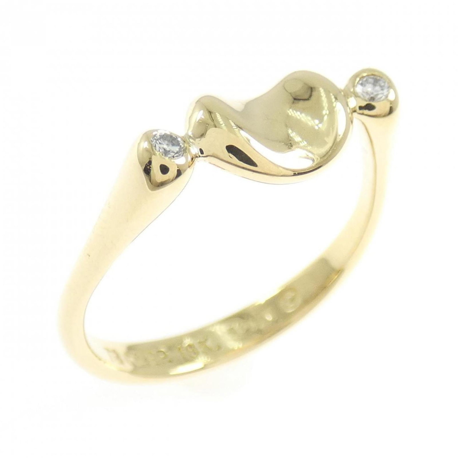 Tiffany Band Ring Yellow Gold (18K): Tiffany Band Ring Yellow Gold (18K) Tiffany's iconic yellow gold band ring features a diamond stone in an 18K setting. The ring has been well-cared for and shows only minor signs of wear, with a few s