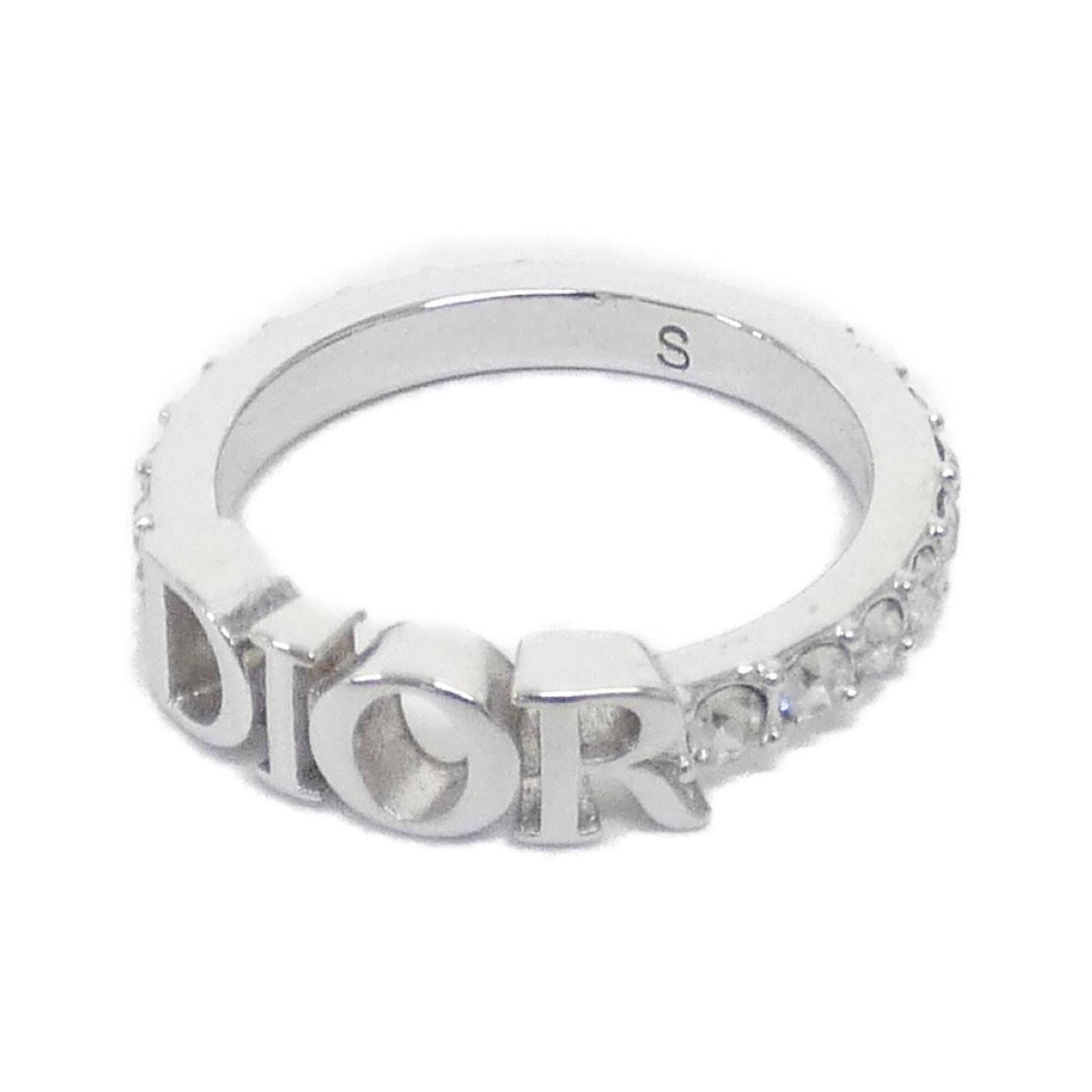 Christian Dior Band Ring: Christian Dior Band Ring The Christian Dior Band Ring boasts a sleek, modern design with clear and silver accents. With its classic band style, this ring is perfect for everyday wear. In very good con