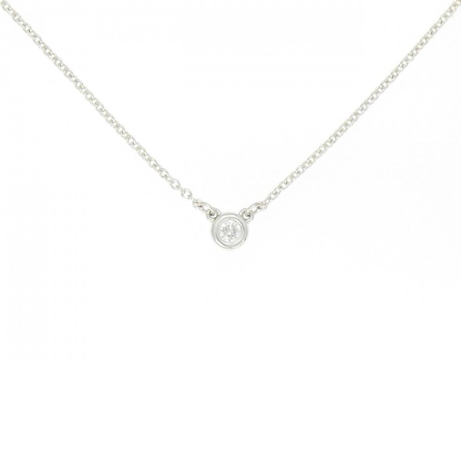 Tiffany By the Yard Necklace: Tiffany By the Yard Necklace Tiffany By the Yard Necklace is a beautiful silver necklace featuring a diamond stone. The 41 cm chain has some scratches and dirt, giving it a few traces of usage, but ov