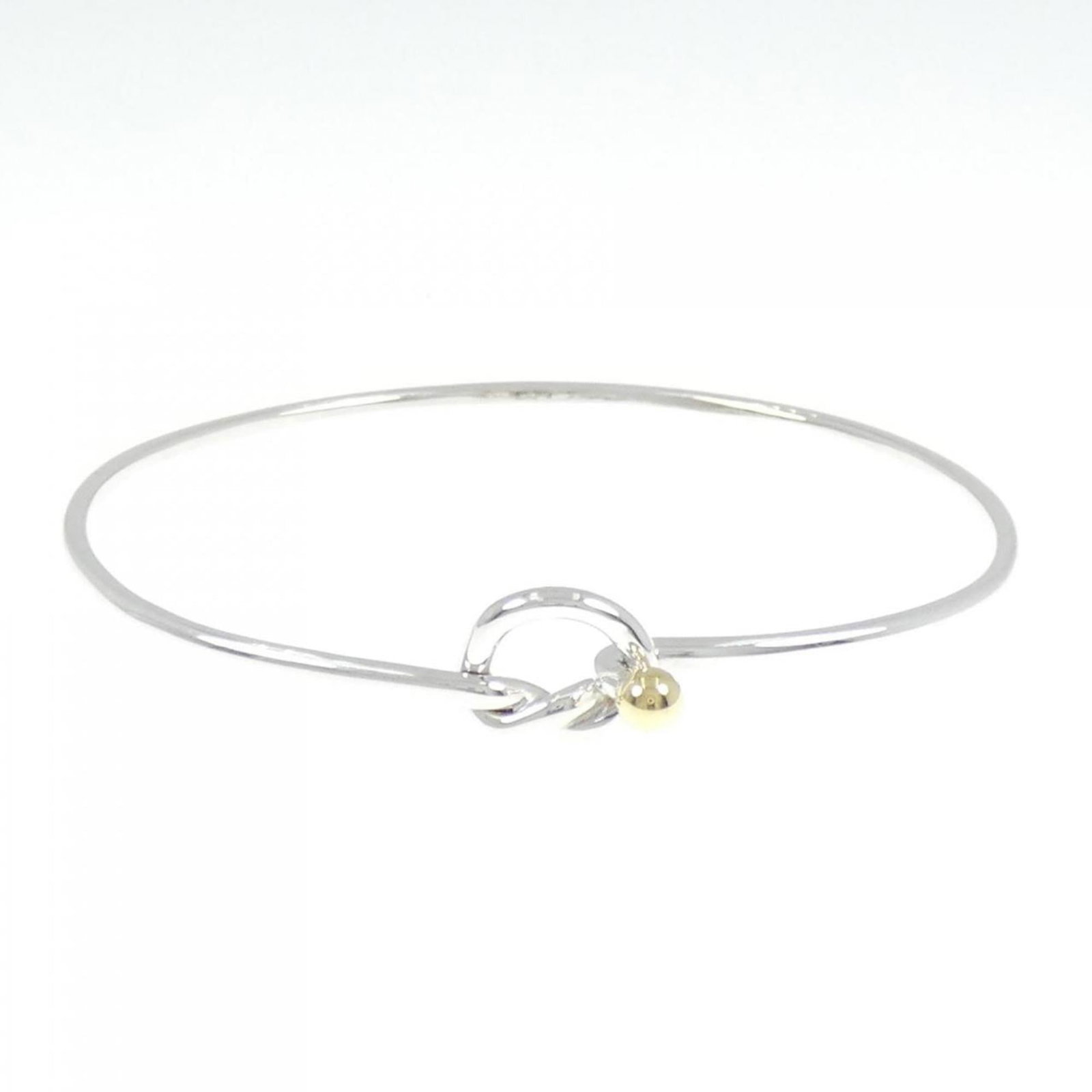Tiffany Bangle Silver 925, Yellow Gold (18K): Tiffany Bangle Silver 925, Yellow Gold (18K) Silver and yellow gold combine in this elegant Tiffany bangle, crafted from high-quality 925 silver and 18K yellow gold. Measuring 17cm in length, it