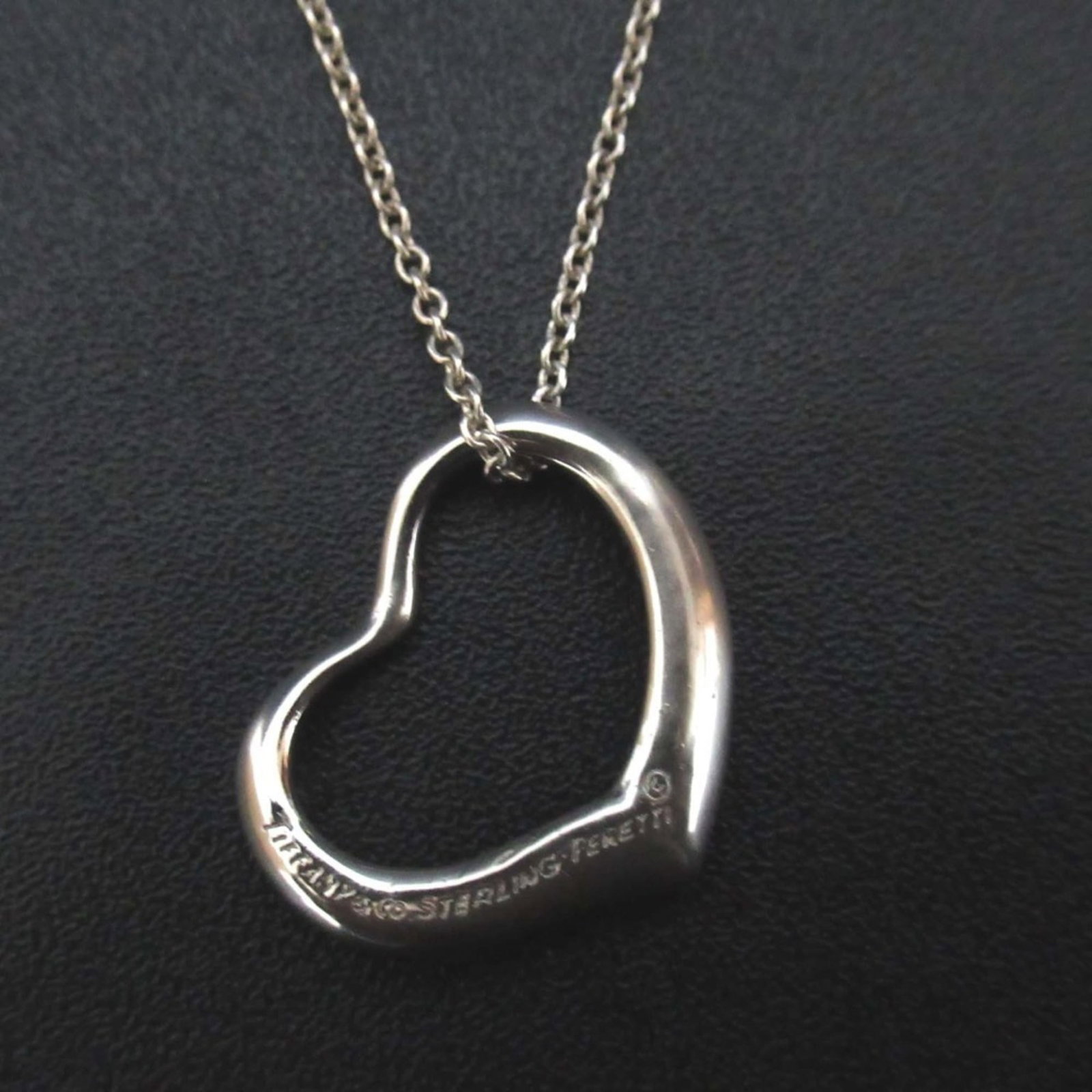Tiffany & Co. Elsa Peretti Open Heart Necklace Pendant in 925 SV Silver for Women: Tiffany & Co. Elsa Peretti Open Heart Necklace Pendant in 925 SV Silver for Women Tiffany & Co.'s Elsa Peretti Open Heart Necklace Pendant shines in sterling silver, its sleek design making it a