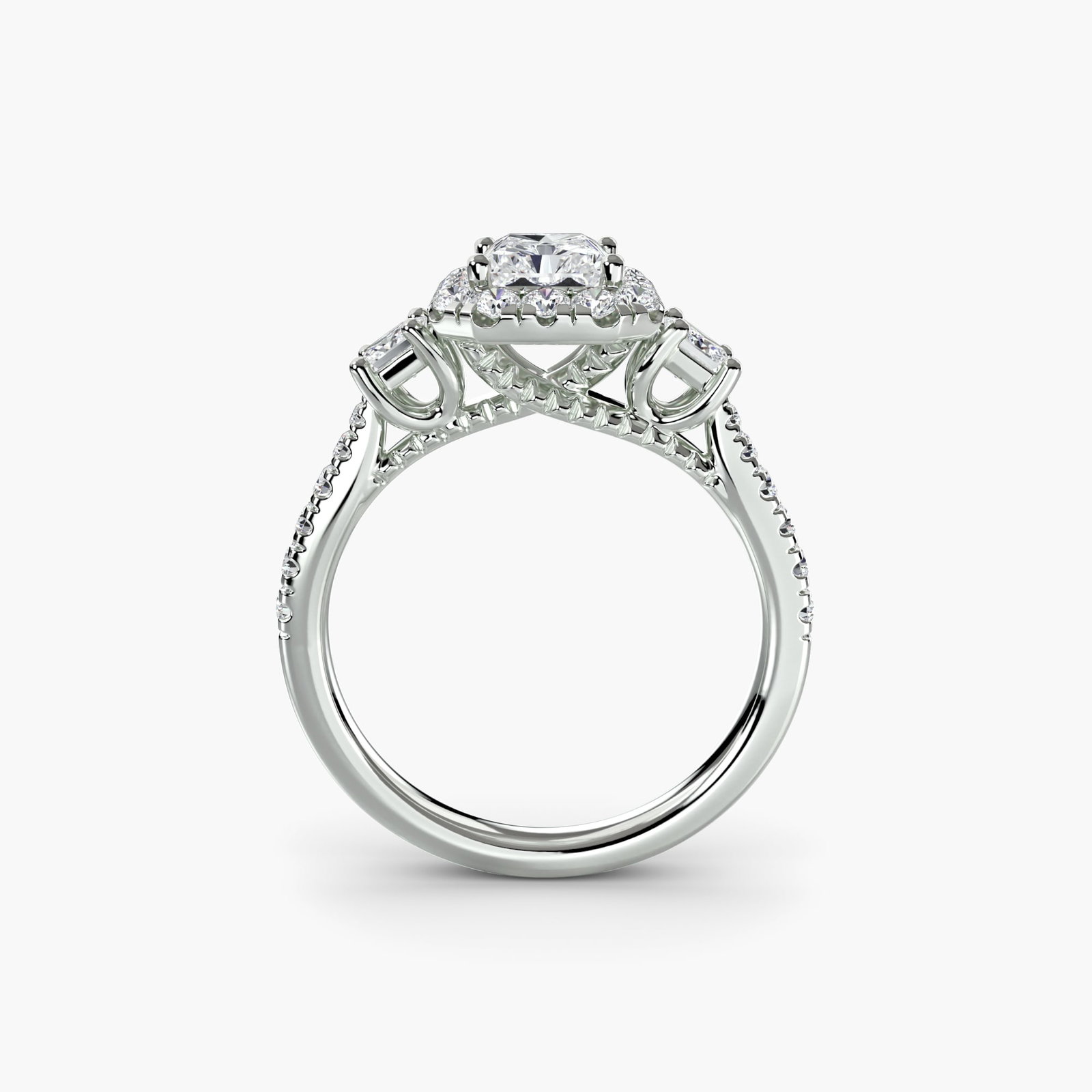 Halo Radiant 14Kt White Gold Ring Setting: Halo Radiant 14Kt White Gold Ring Setting Radiant 14Kt White Gold Ring Setting with 30 Lab Grown Side Stones. This stunning ring setting boasts a total carat weight of 0.706, featuring 30 lab grown st