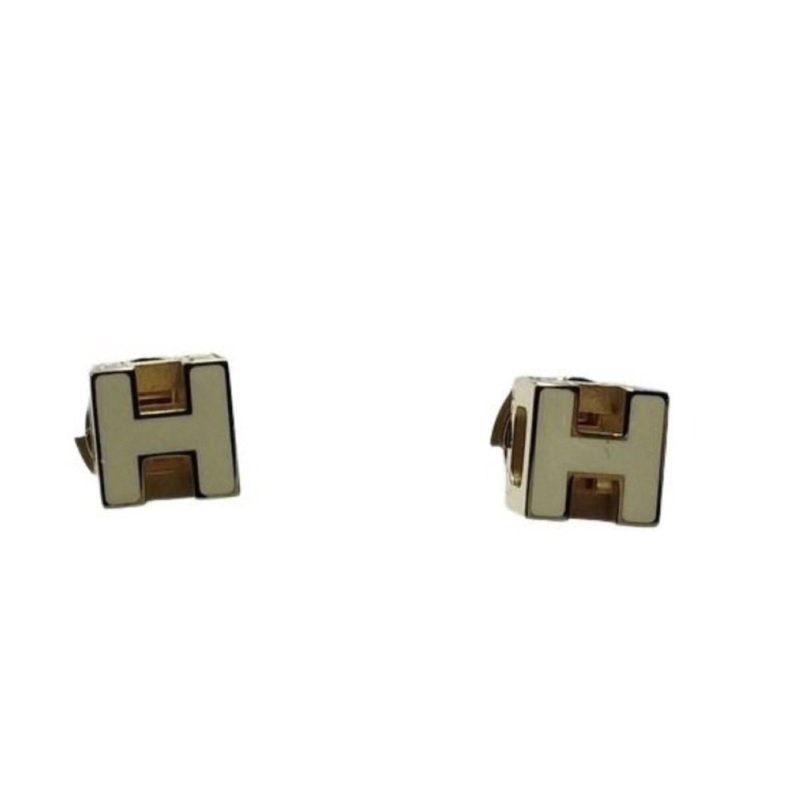 Hermes Stud Earrings Metal: Hermes Stud Earrings Metal Stud earrings from Hermes in gold and white metal. The small size (0.80mm x 0.80mm) makes them delicate, while their stud design provides a subtle yet elegant touch to any o