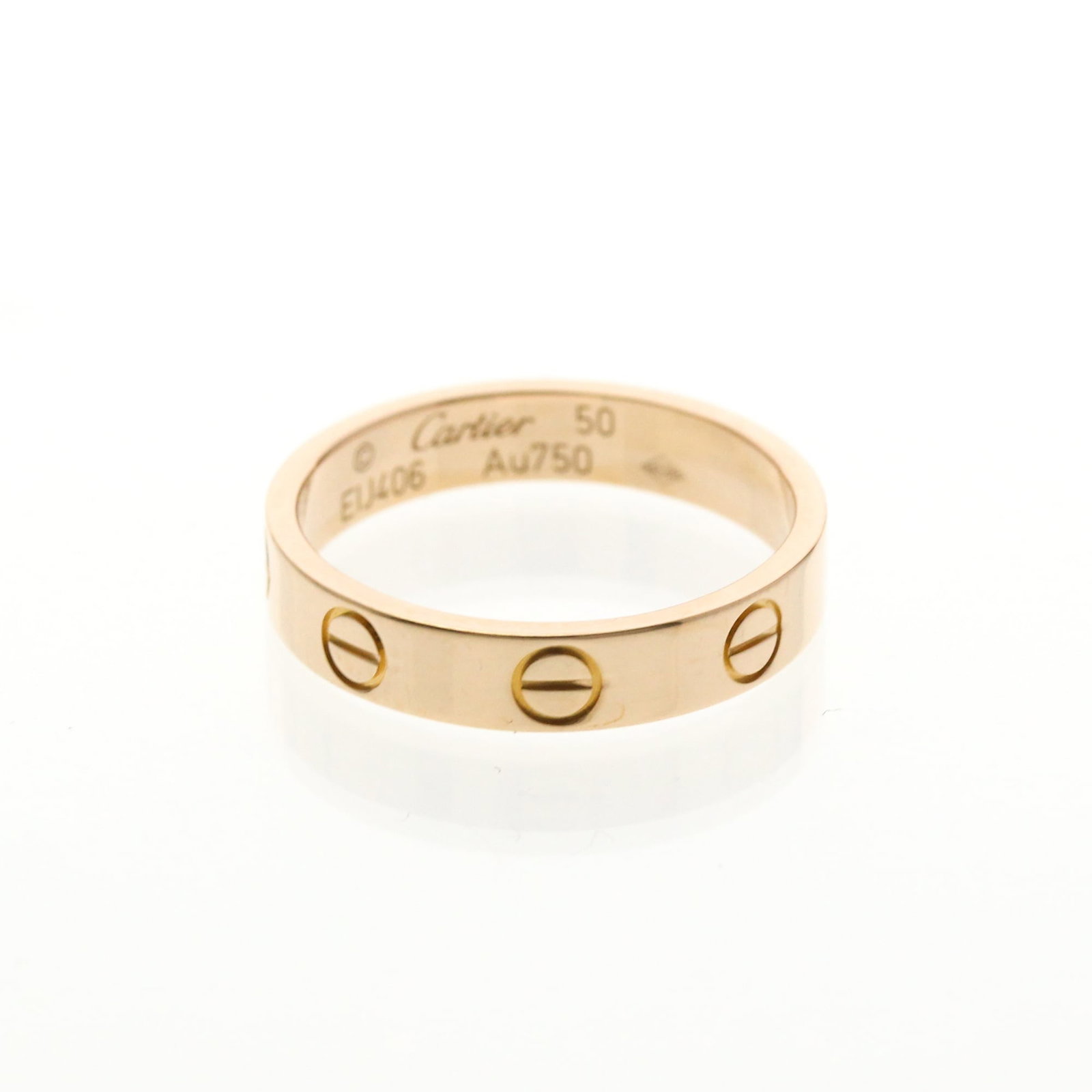 Cartier Band Ring Pink Gold (18K): Cartier Band Ring Pink Gold (18K) Cartier's iconic band ring style shines in this beautiful pink gold (18K) design. With its slender 3.6mm width and 50 US size, this ring exudes understated elegance.