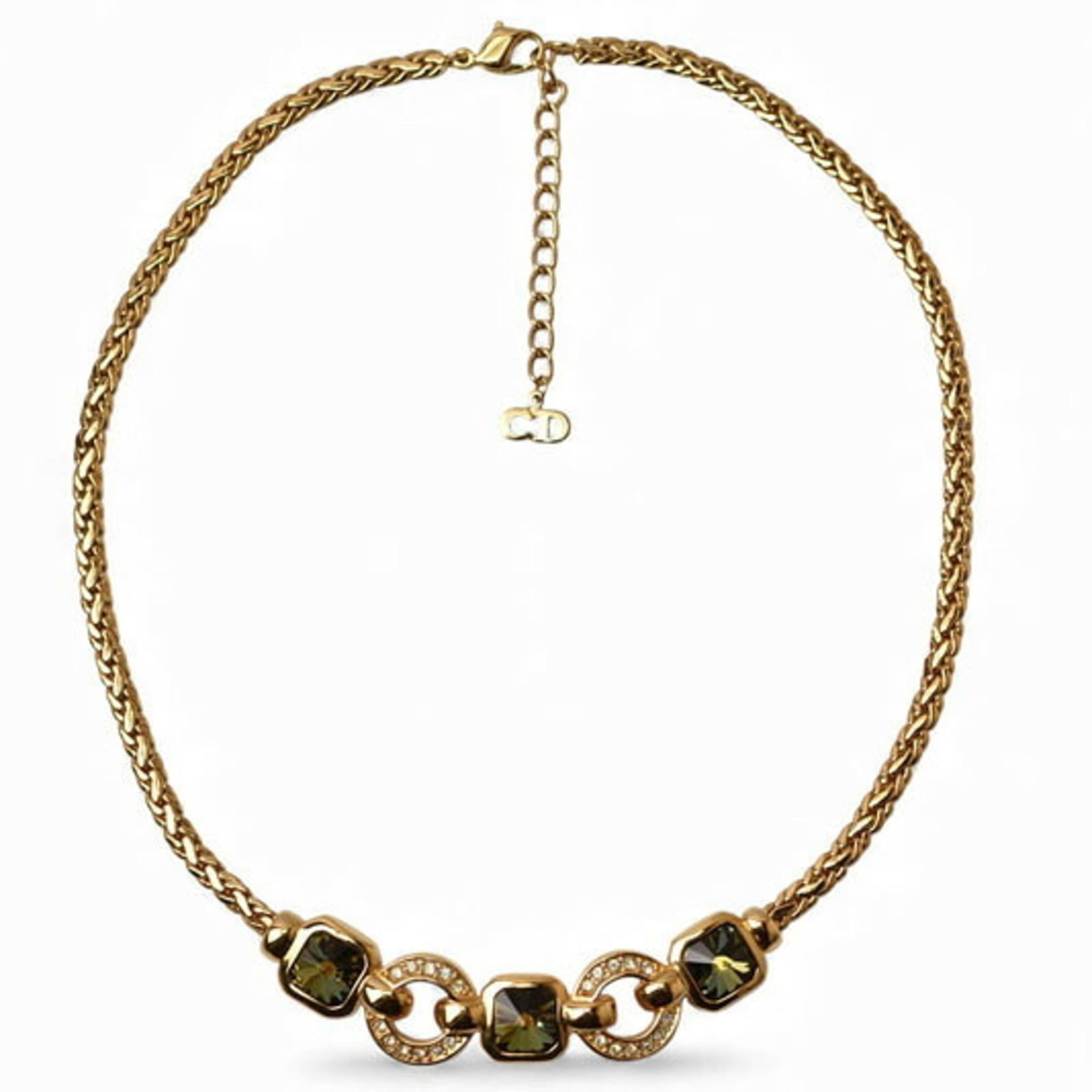 Christian Dior necklace with rhinestones in green and gold: Christian Dior necklace with rhinestones in green and gold Gold plated Christian Dior necklace with rhinestones in green and gold features a 3mm pendant. The necklace's adjustable circumference