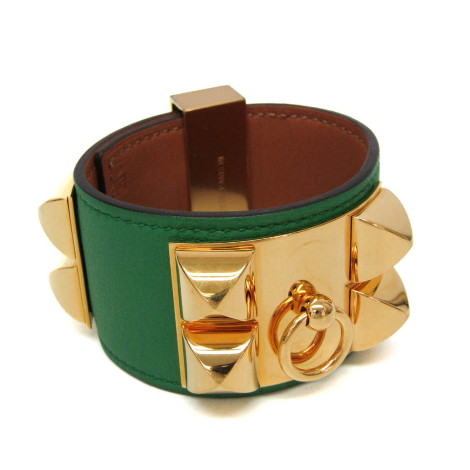 Hermes Bangle Box Calf Leather, Metal: Hermes Bangle Box Calf Leather, Metal The Hermes Bangle Box Calf Leather, Metal features a gold finish with intricate metalwork, set against box calf leather. A few traces of usage are evident,