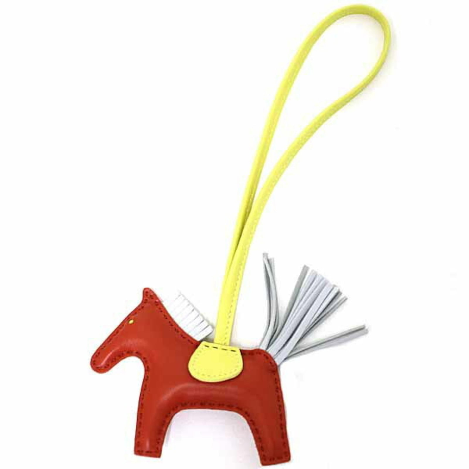 Hermes Handbag Charm Agneau Milo: Hermes Handbag Charm Agneau Milo Agneau Milo handbag charm from Hermes features a vibrant lime and red color combination. Made from high-quality Agneau Milo material, this charm boasts a unique design