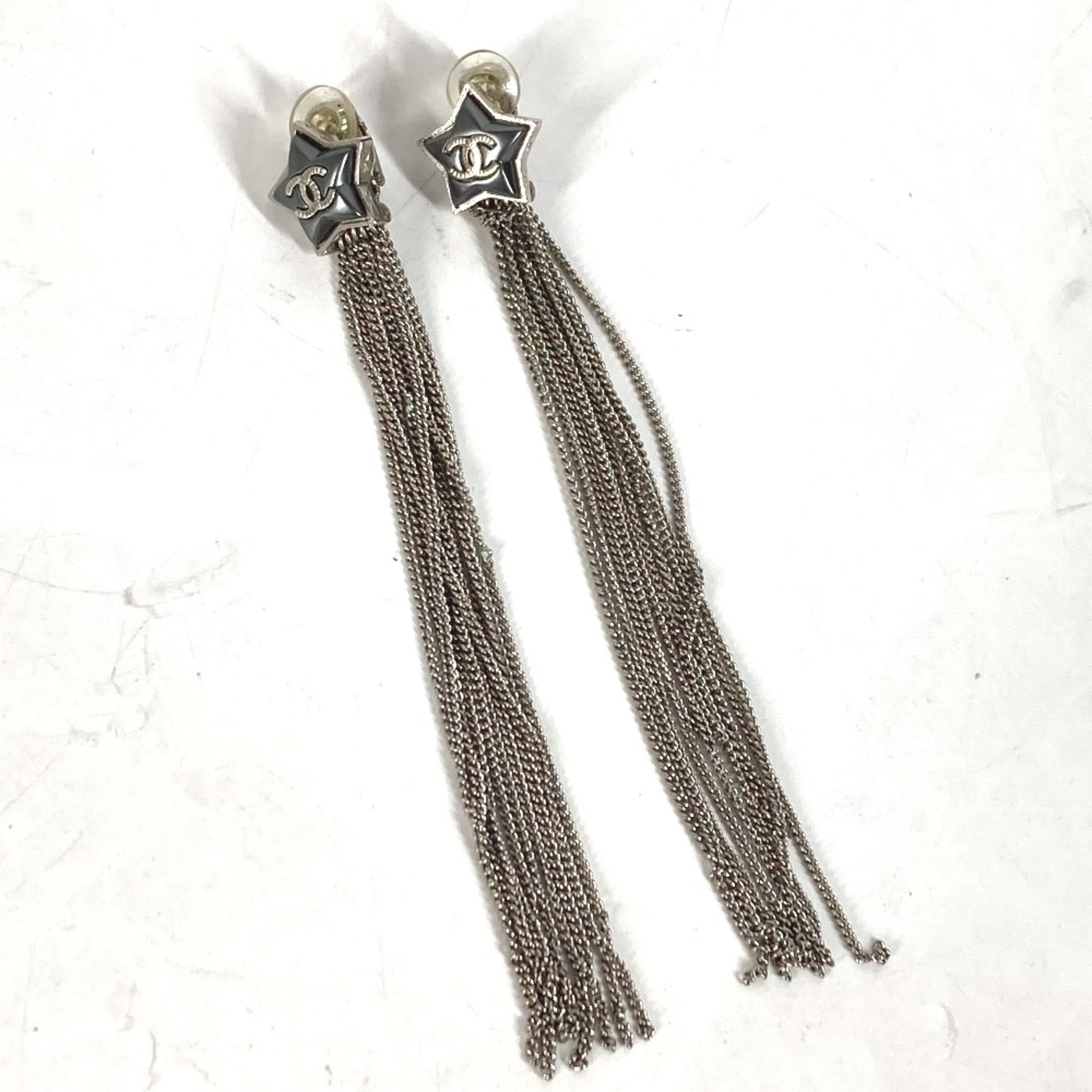 Chanel Stud Earrings Other: Chanel Stud Earrings Other Silver Chanel stud earrings in very good condition, with some minor scratches and dirt visible. A few traces of usage are present, but overall they remain in excellent